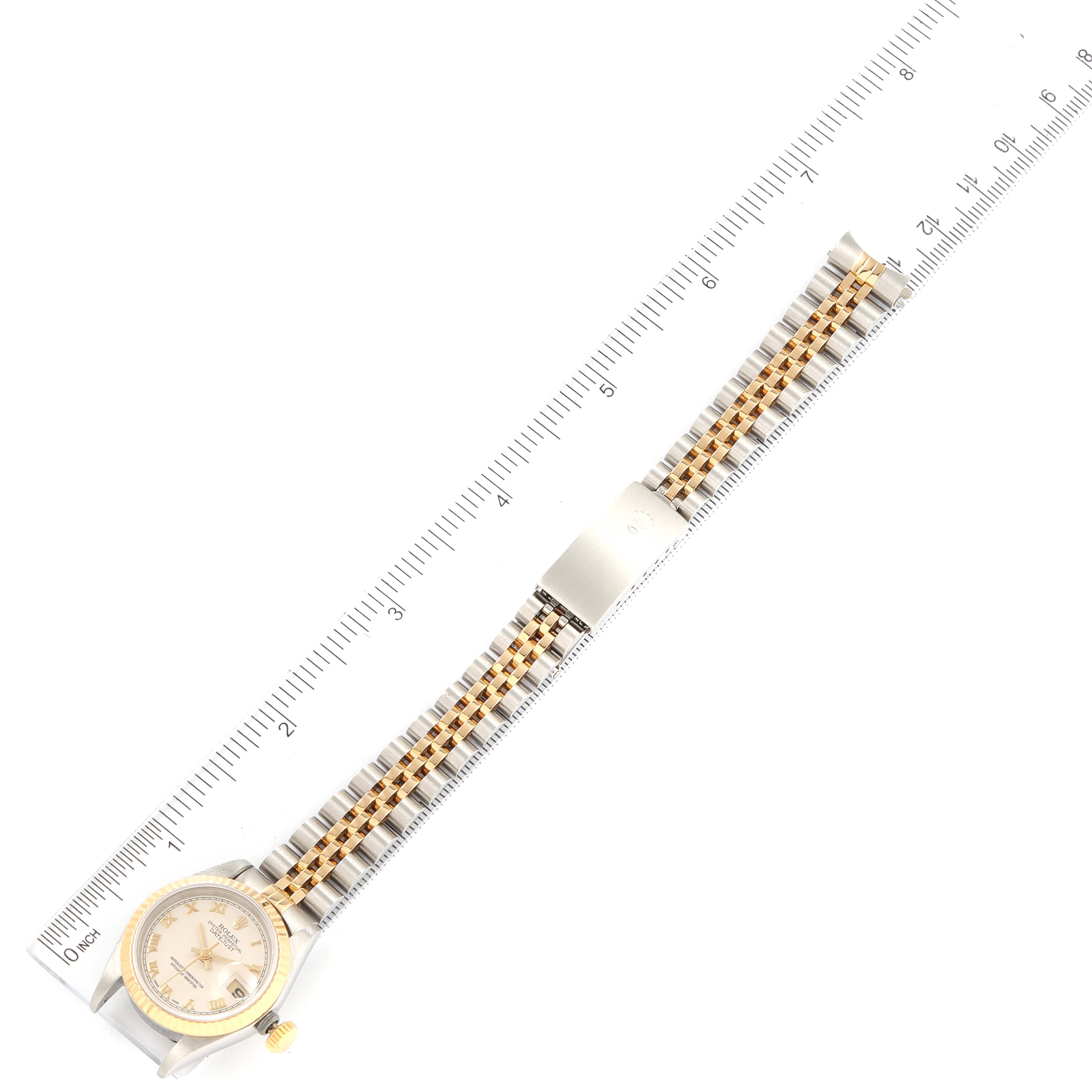 The image shows the full length of a Rolex Datejust 69173 Women's Steel and Gold (two tone) Beige Dial 69173 Women's Steel and Gold (two tone) Beige Dial watch laid flat next to a ruler, highlighting the dial, case, and bracelet.