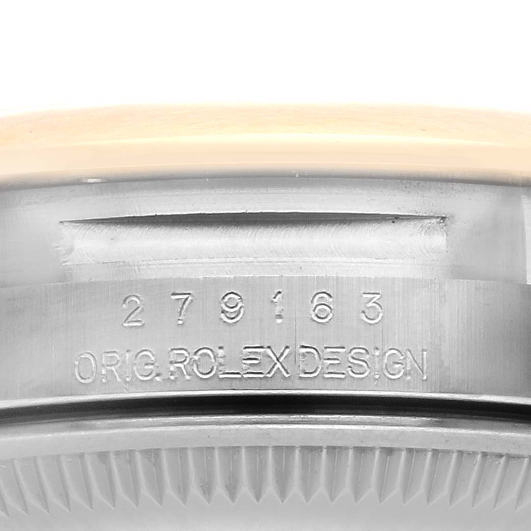 The image shows the side view of the Rolex Datejust 67166 Women's Steel and Gold (two tone) Champagne Dial 67166 Women's Steel and Gold (two tone) Champagne Dial watch, highlighting the engraved serial number and "ORIG. ROLEX DESIGN."