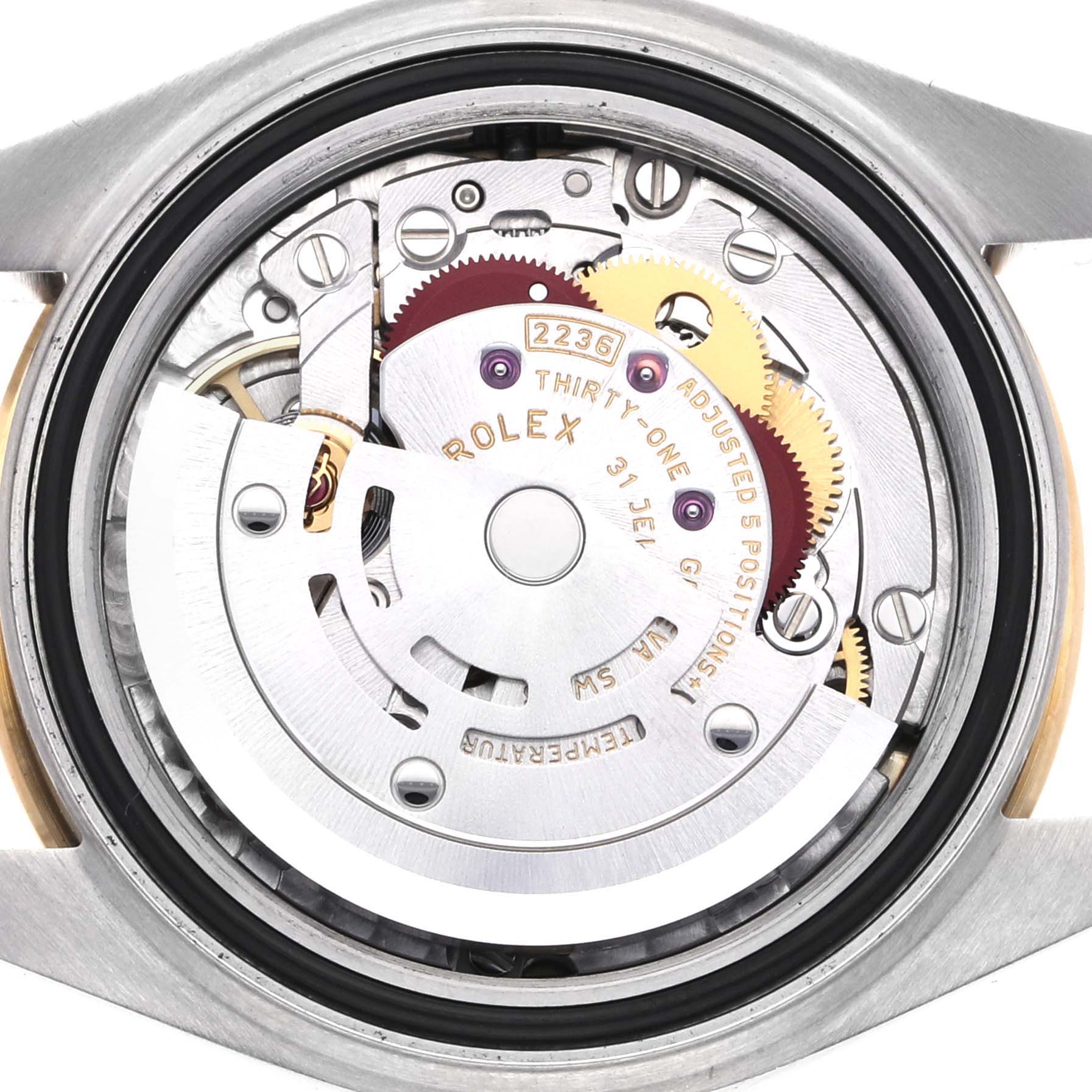 The image shows a close-up of the movement in a Rolex Datejust 67166 Women's Steel and Gold (two tone) Champagne Dial 67166 Women's Steel and Gold (two tone) Champagne Dial, highlighting gears and rotors.