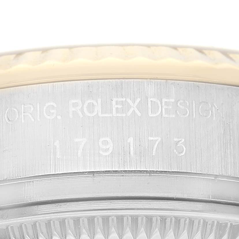 This image shows the side engraving on the case of a Rolex Datejust 179173 Women's Steel and Gold (two tone) Mother of Pearl Dial 179173 Women's Steel and Gold (two tone) Mother of Pearl Dial watch.