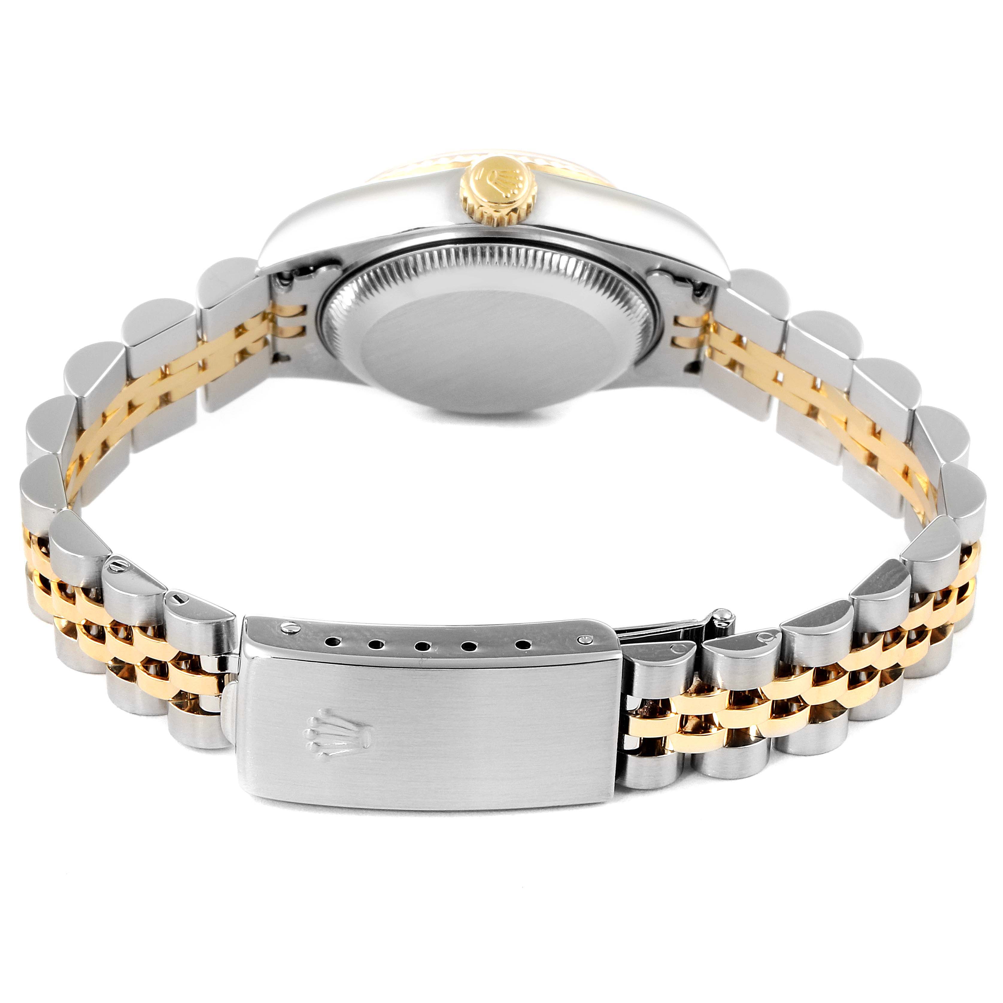 The image shows the back view of a Rolex Datejust 79173 Women's Steel and Gold (two tone) Red Dial 79173 Women's Steel and Gold (two tone) Red Dial watch, highlighting its case back, crown, and two-tone bracelet with clasp.