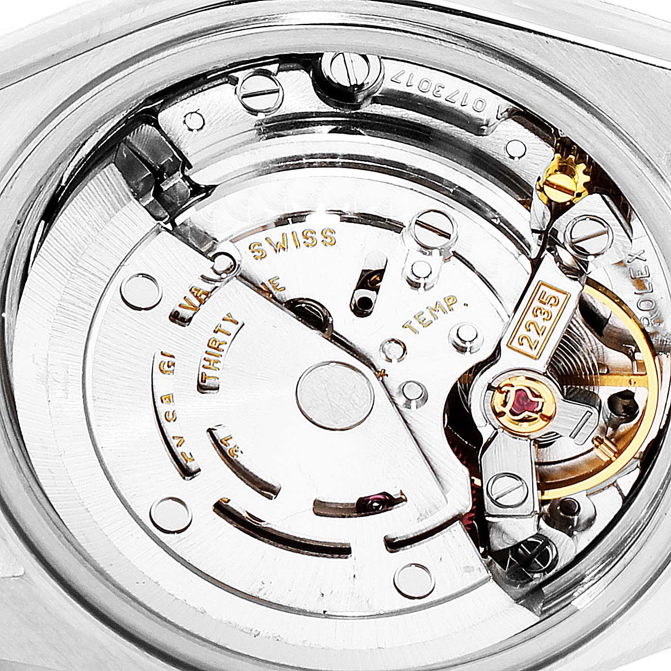 This image shows a close-up of the movement of a Rolex Datejust 79173 Women's Steel and Gold (two tone) Red Dial 79173 Women's Steel and Gold (two tone) Red Dial watch, highlighting its intricate mechanical parts.