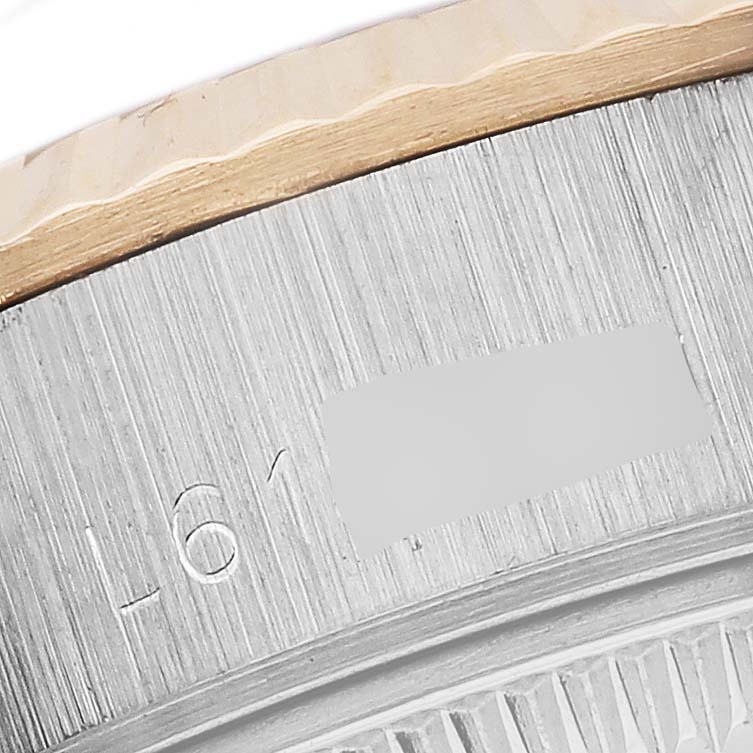 This close-up image shows the side part of the bezel of a Rolex Datejust 69173 Women's Steel and Gold (two tone) White Dial 69173 Women's Steel and Gold (two tone) White Dial, highlighting the fluted edge and material details.