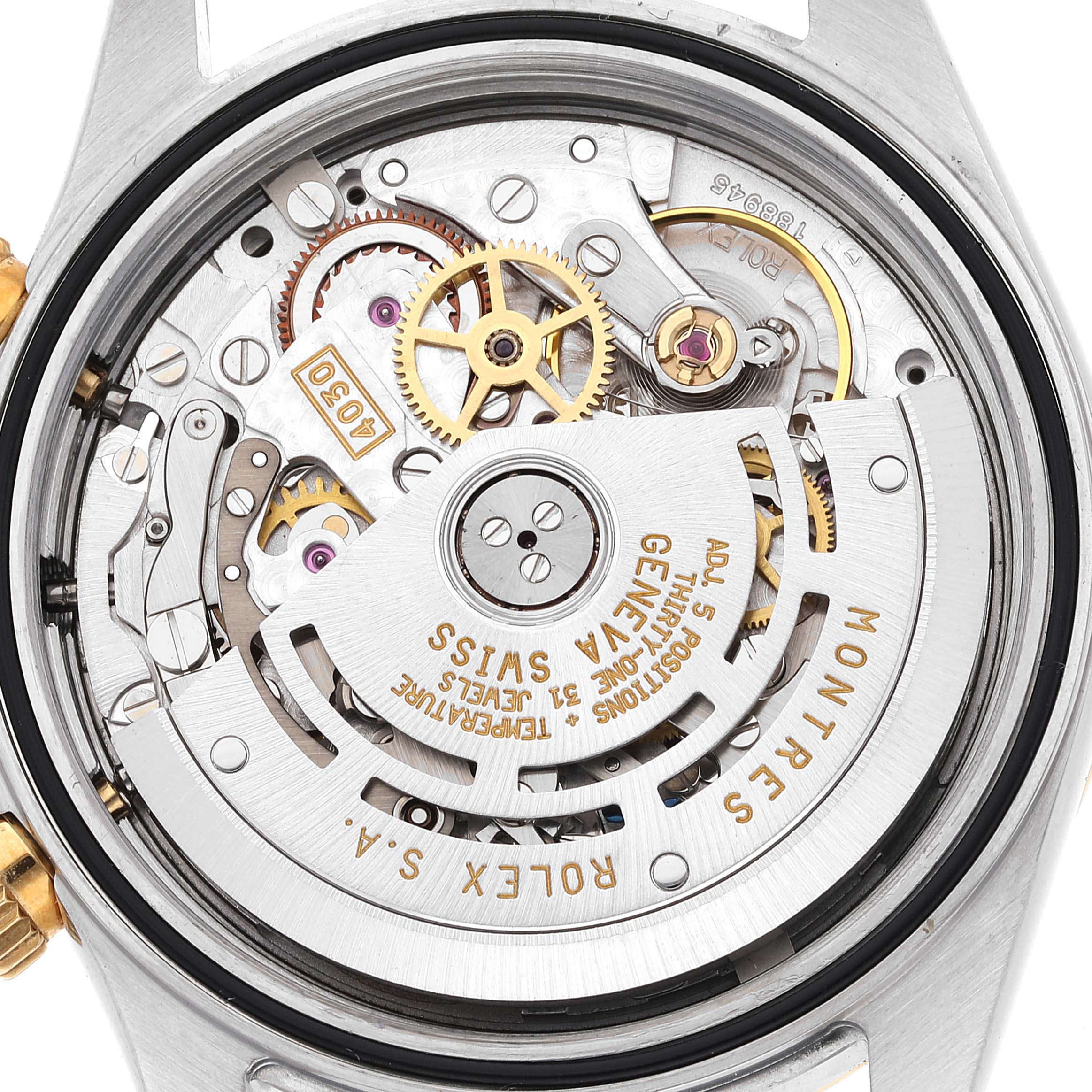 The image shows an overhead view of the movement and internal mechanics of a Rolex Daytona 16523G Men
s Steel and Gold (two tone) Black Dial 16523G Men
s Steel and Gold (two tone) Black Dial watch.