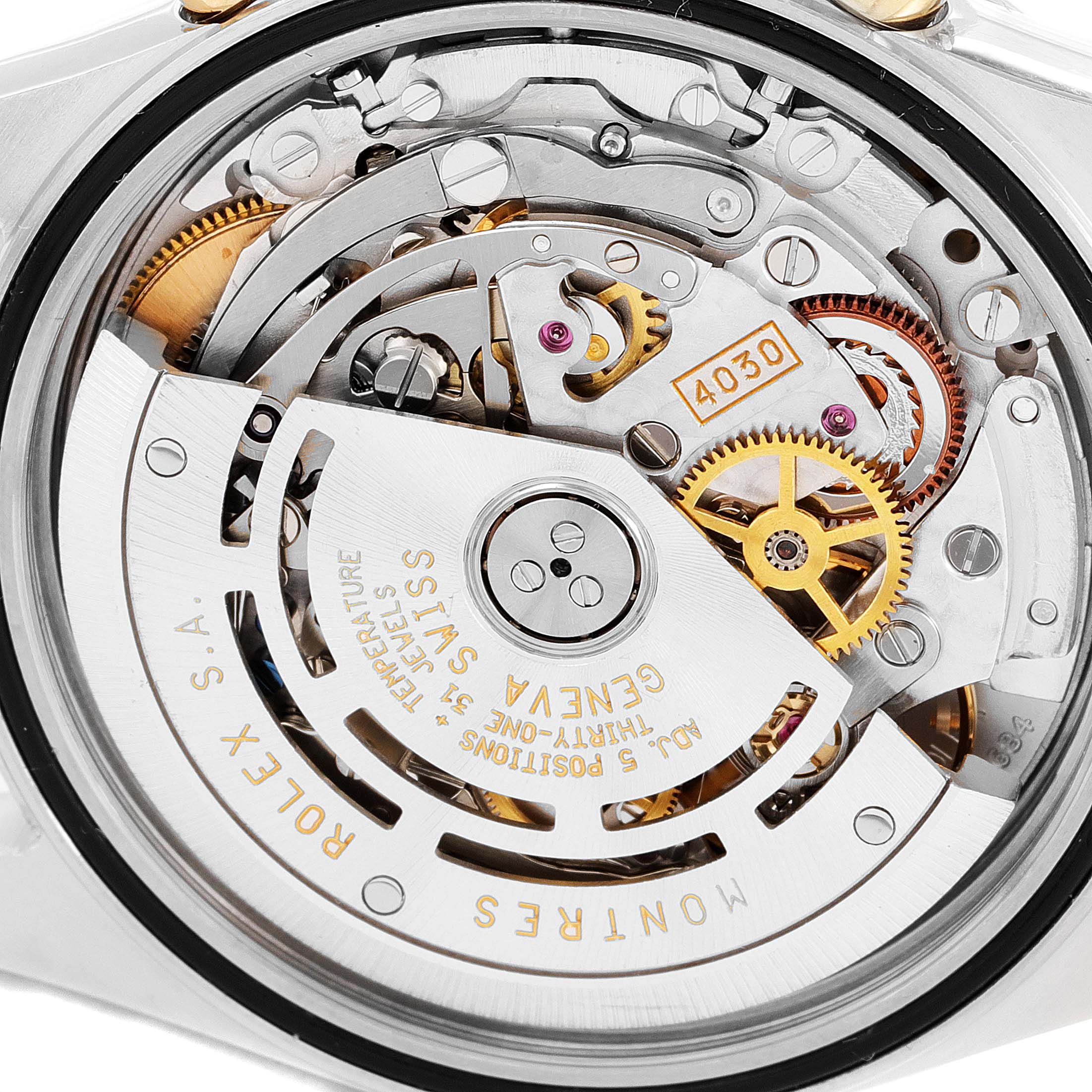 This close-up shows the intricate movement and inner mechanism of the Rolex Daytona 16523 Men
s Steel and Gold (two tone) White Dial 16523 Men
s Steel and Gold (two tone) White Dial watch model.