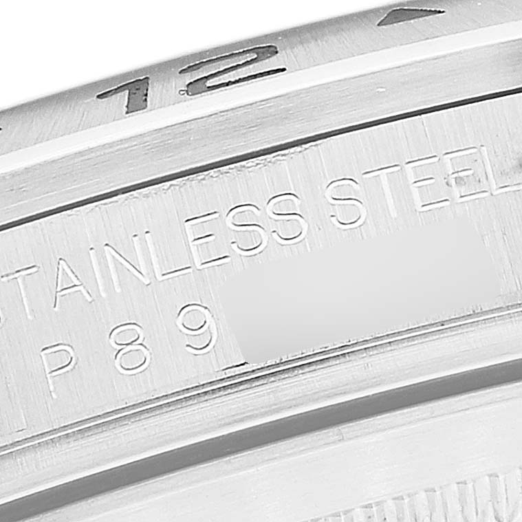 This is a close-up image of the rim of a Rolex Explorer 16570 Men
s Stainless Steel Black Dial 16570 Men
s Stainless Steel Black Dial watch, displaying part of the bezel and engraved text.