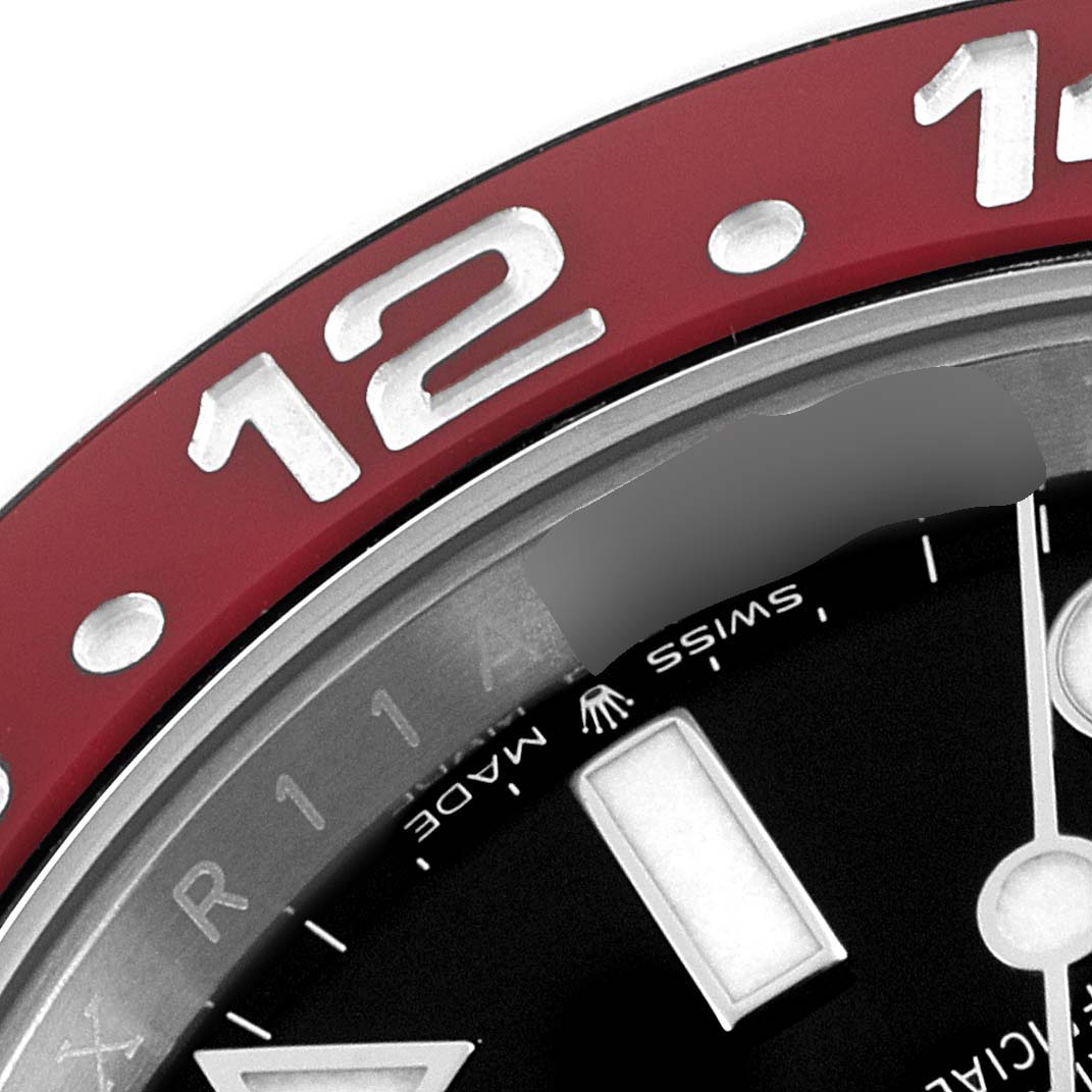 This close-up image shows the bezel and part of the dial of a Rolex GMT-Master 126710 Men
s Stainless Steel Black Dial 126710 Men
s Stainless Steel Black Dial watch.