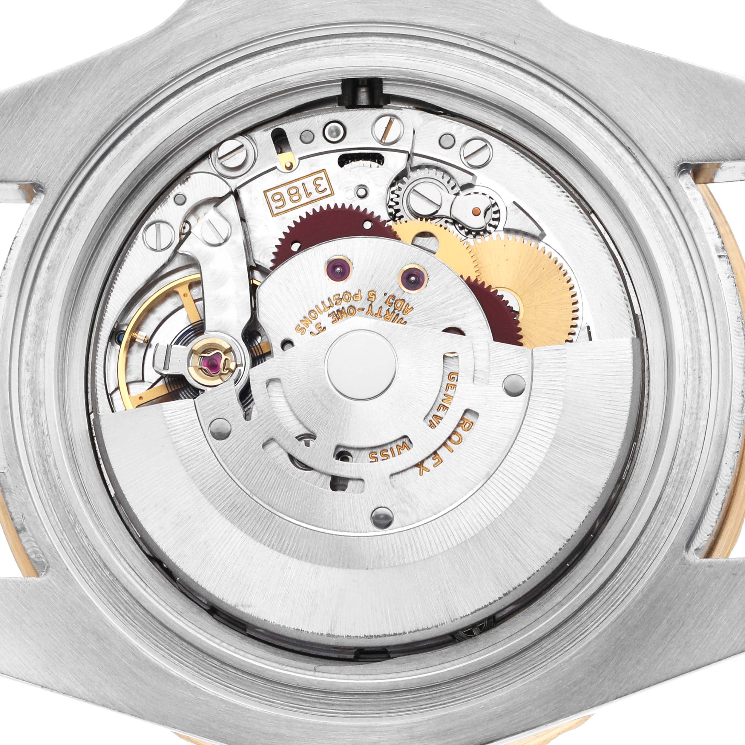 The image shows an overhead view of the movement inside the Rolex GMT-Master 116713 Men's Steel and Gold (two tone) Black Dial, showcasing its intricate internal components.