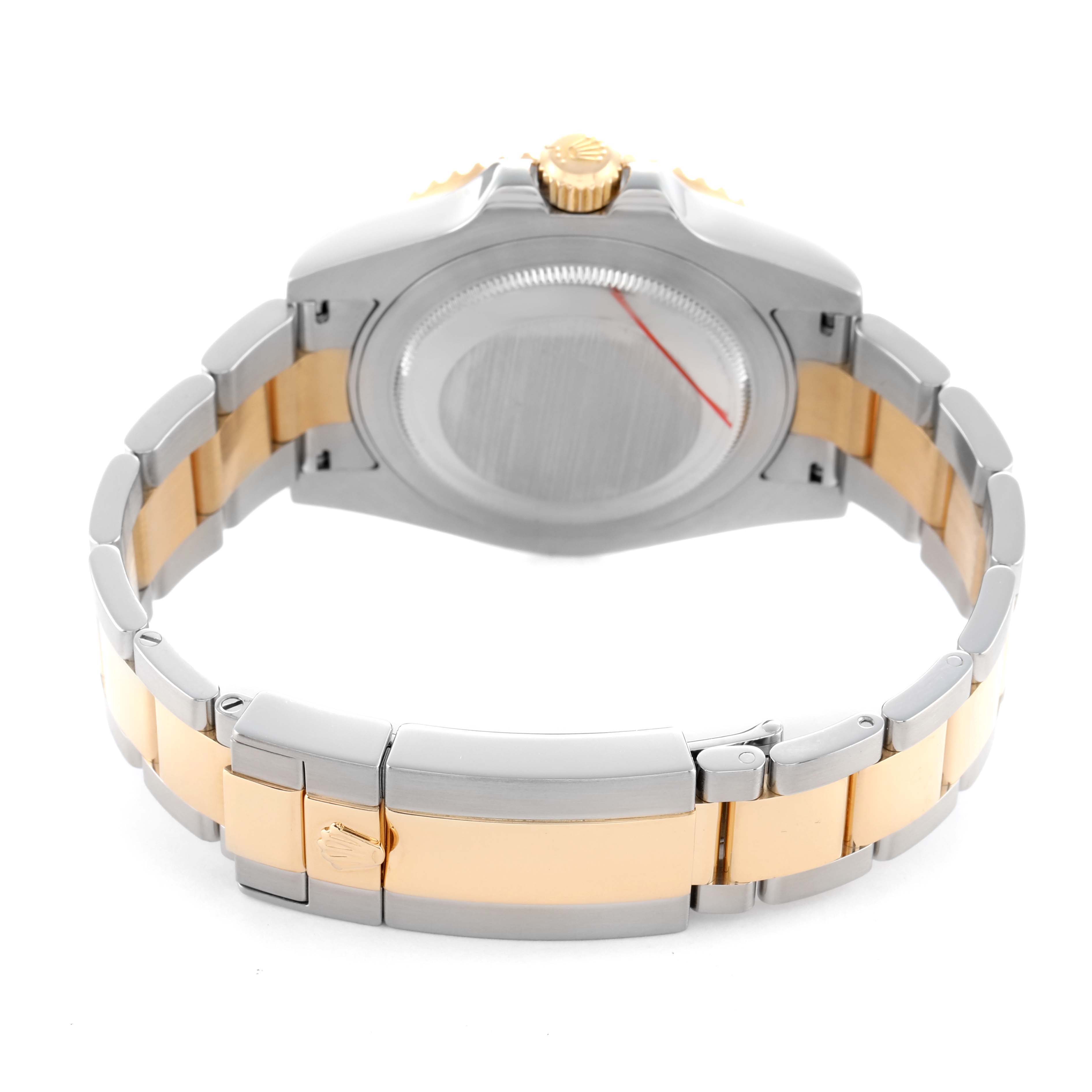 The Rolex GMT-Master 116713 Men's Steel and Gold (two tone) Black Dial watch is shown from the back, highlighting the clasp and case back.