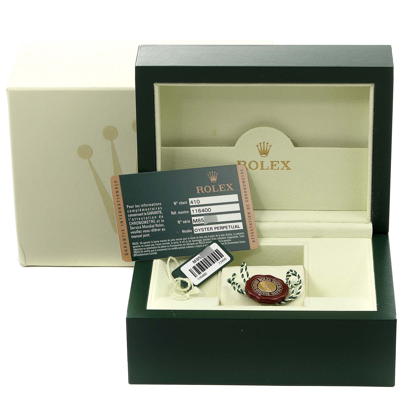 The image shows an open box of a Rolex Milgauss 116400 Men's Stainless Steel Black Dial 116400 Men's Stainless Steel Black Dial model, displaying its authenticity card and a tag inside.