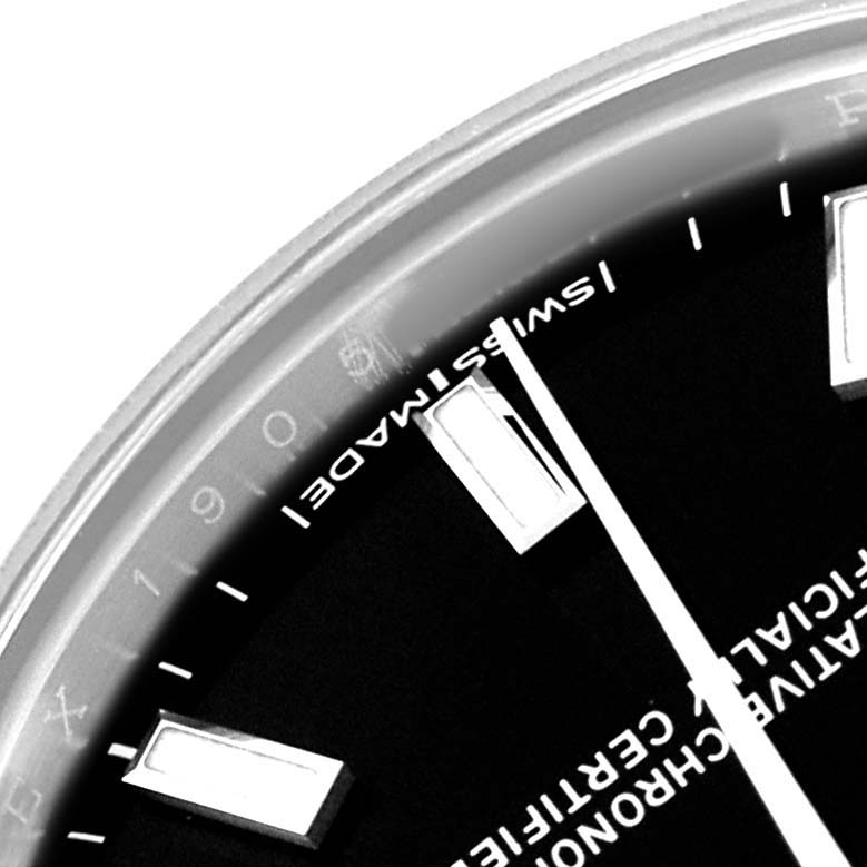 The image shows a close-up of the dial and markers of a Rolex Mid-Size 177200 Women's Stainless Steel Black Dial watch from an angled perspective.