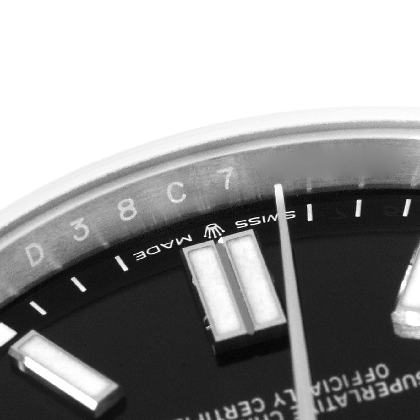 This close-up image shows the dial, indices, and part of the bezel of a Rolex Oyster Perpetual 124300 Men
s Stainless Steel Black Dial 124300 Men
s Stainless Steel Black Dial watch.
