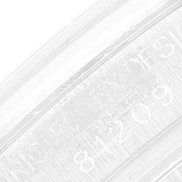 This close-up image shows the serial number engraving inside the case of a Rolex Pearlmaster 81209 Women's White Gold Mother of Pearl Dial 81209 Women's White Gold Mother of Pearl Dial watch.