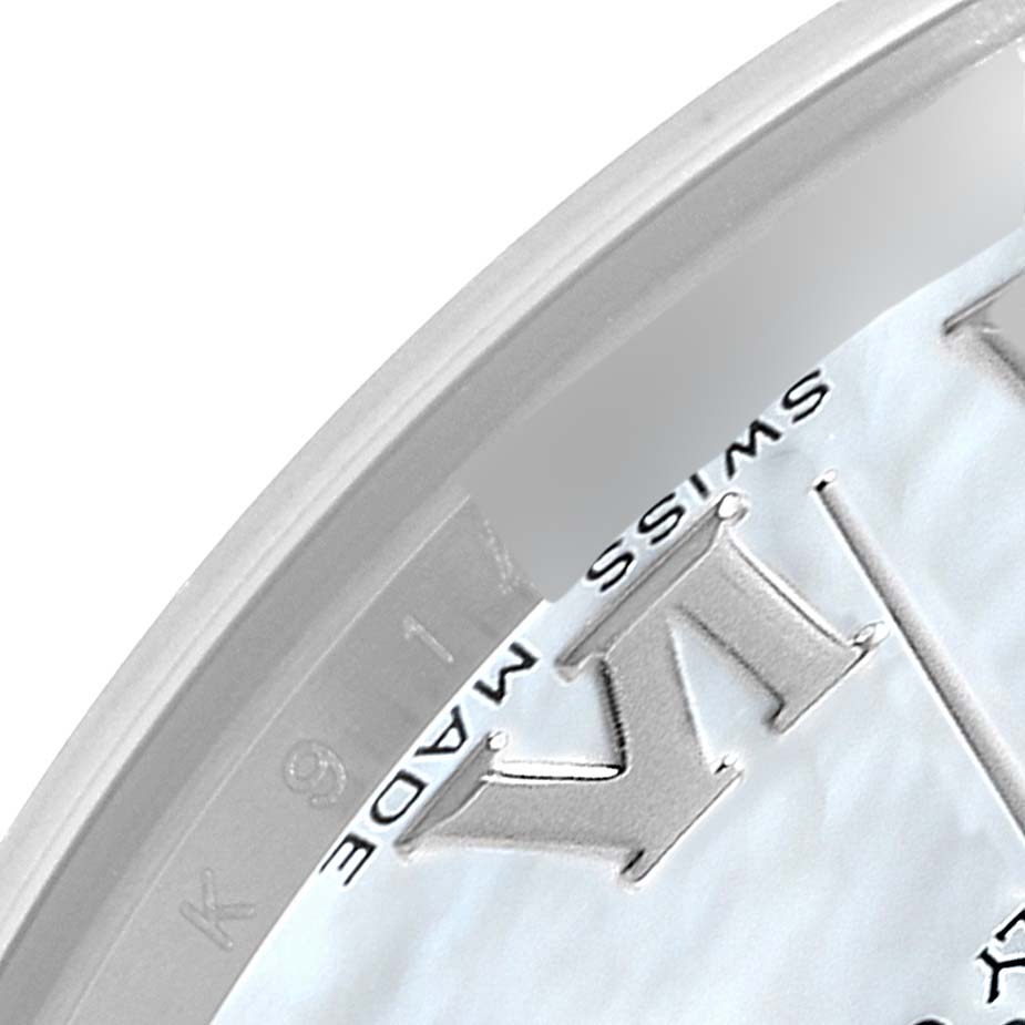 The image shows a close-up of the dial with Roman numerals and part of the bezel of a Rolex Pearlmaster 81209 Women's White Gold Mother of Pearl Dial 81209 Women's White Gold Mother of Pearl Dial watch.
