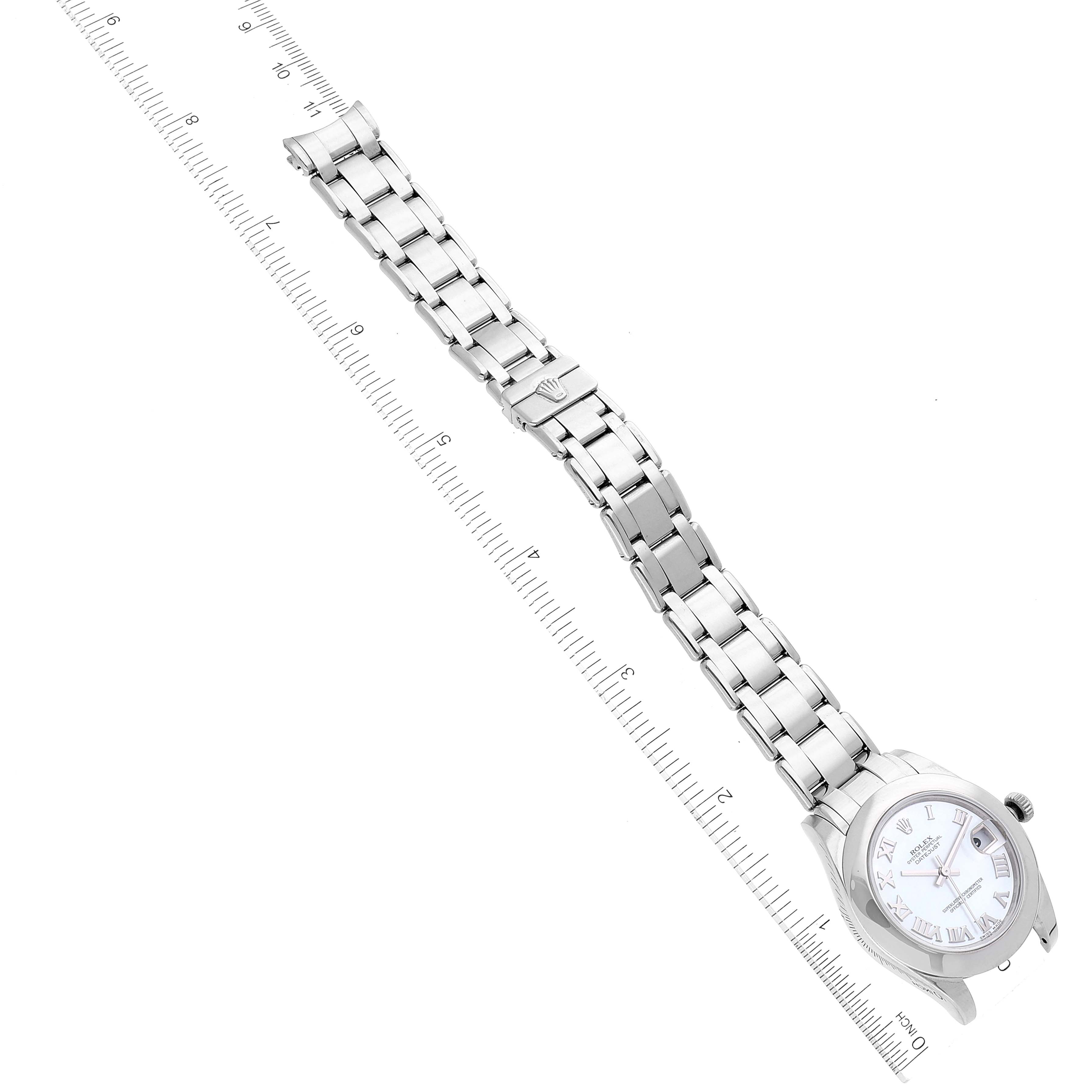 The image shows a Rolex Pearlmaster 81209 Women's White Gold Mother of Pearl Dial 81209 Women's White Gold Mother of Pearl Dial watch laid flat with its full-length bracelet and a ruler for scale.
