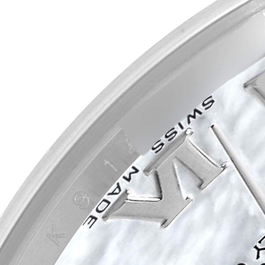 The image shows a close-up of the edge of the dial on the Rolex Pearlmaster 81209 Women's White Gold Mother of Pearl Dial, highlighting the "SWISS MADE" text and part of the Roman numeral hour marker.