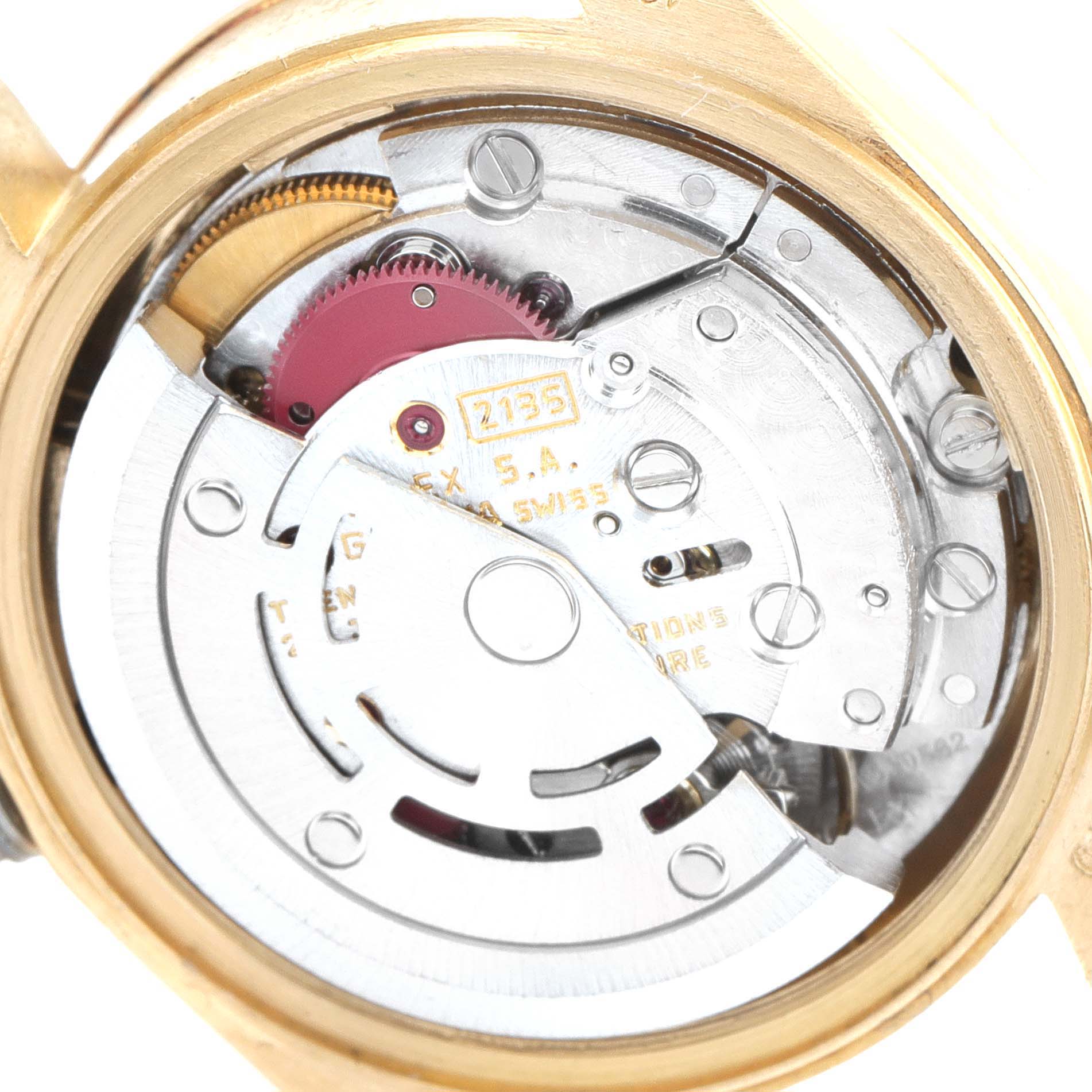 This image shows the inner movement mechanism of a Rolex President 69278 Women
s Yellow Gold White Dial 69278 Women
s Yellow Gold White Dial model watch from an open case back angle.