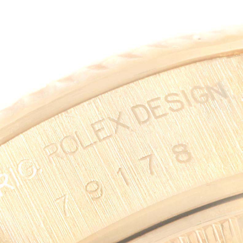 The image shows a close-up of the engraved caseback of the President model by Rolex.
