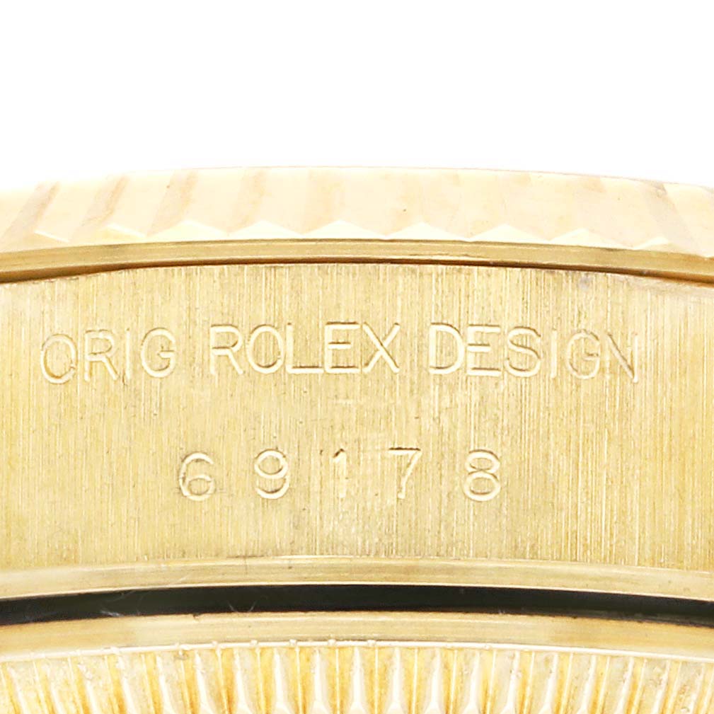The image shows a close-up of the engravings on the case side of a Rolex President 69178 Women's Yellow Gold Champagne Dial 69178 Women's Yellow Gold Champagne Dial watch, featuring the model number.
