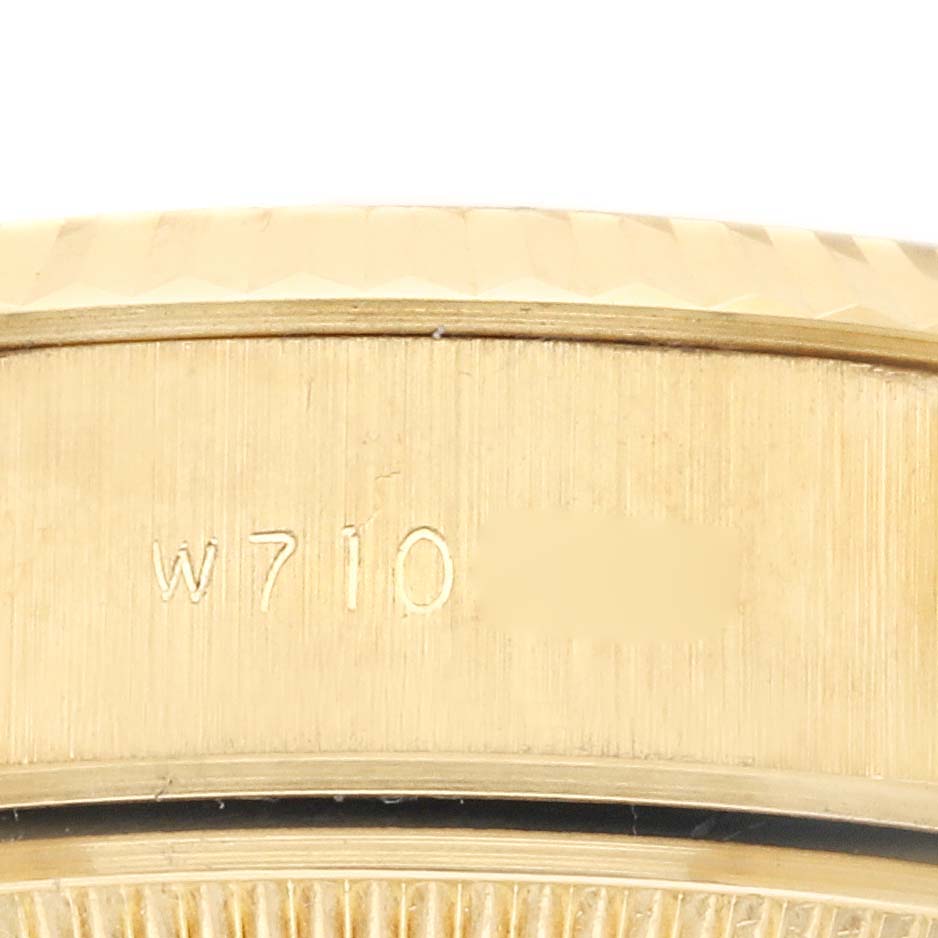 The image shows a close-up of the case side with engraving on the Rolex President 69178 Women's Yellow Gold Champagne Dial 69178 Women's Yellow Gold Champagne Dial model watch.