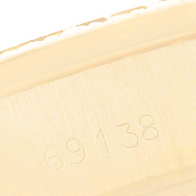 This is a close-up image of the model number "69138" engraved on the side of a Rolex President 69138 Women
s Yellow Gold Champagne Dial 69138 Women
s Yellow Gold Champagne Dial watch.