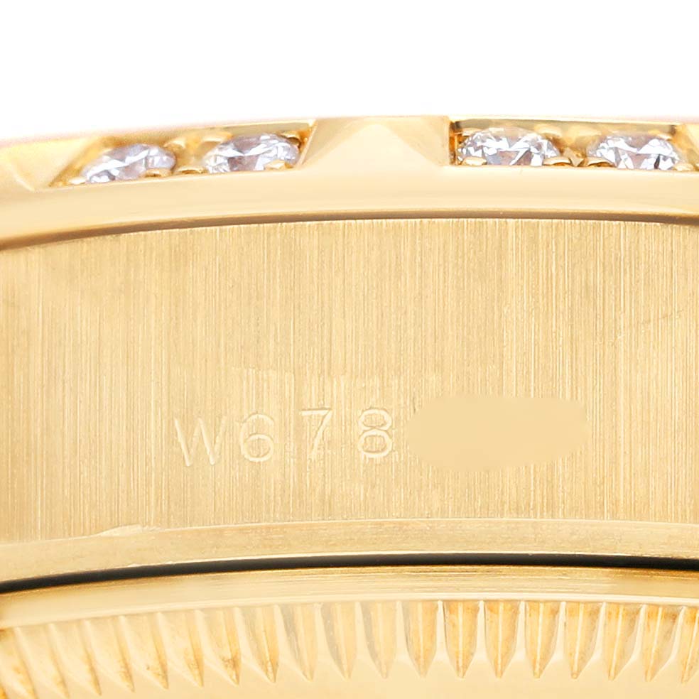 The image shows a close-up of the side case, bezel, and serial number of a Rolex President 69258 Women's Yellow Gold Champagne Dial 69258 Women's Yellow Gold Champagne Dial watch.