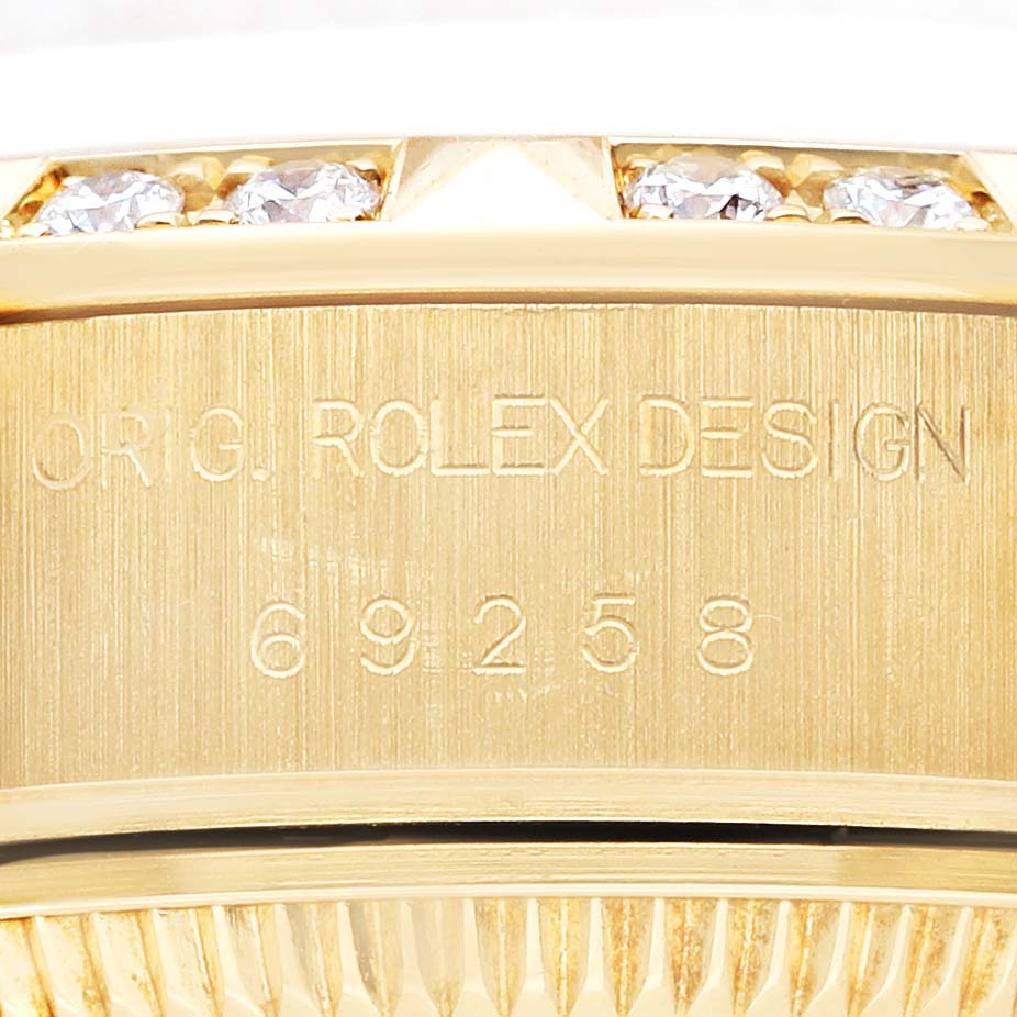 The image shows a close-up of the case side and part of the bezel with diamonds on a Rolex President 69258 Women's Yellow Gold Champagne Dial 69258 Women's Yellow Gold Champagne Dial model.