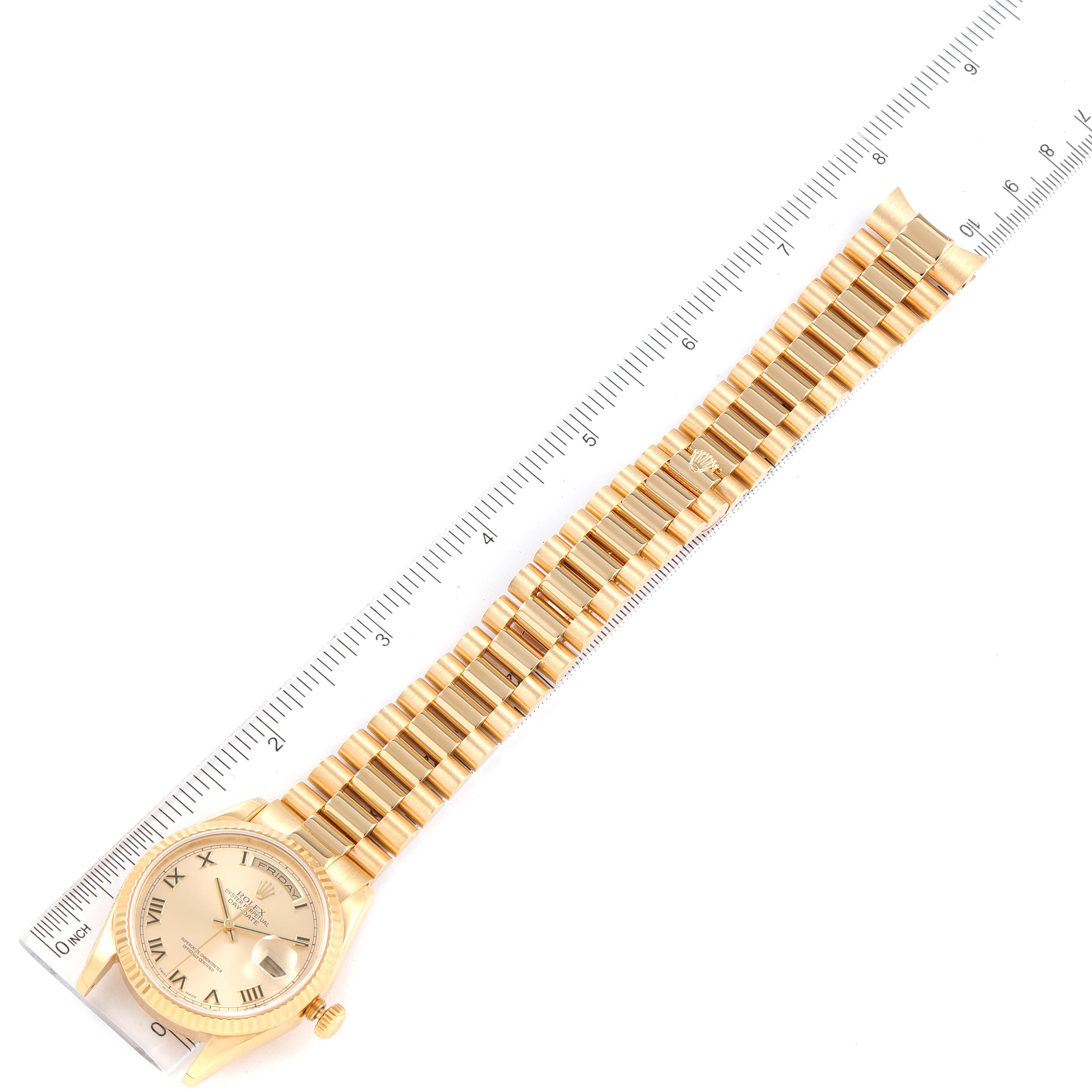 The Rolex President 118238 Men
s Yellow Gold Champagne Dial 118238 Men
s Yellow Gold Champagne Dial model watch is shown from a top view, displaying the dial, bracelet, and a ruler for size reference.