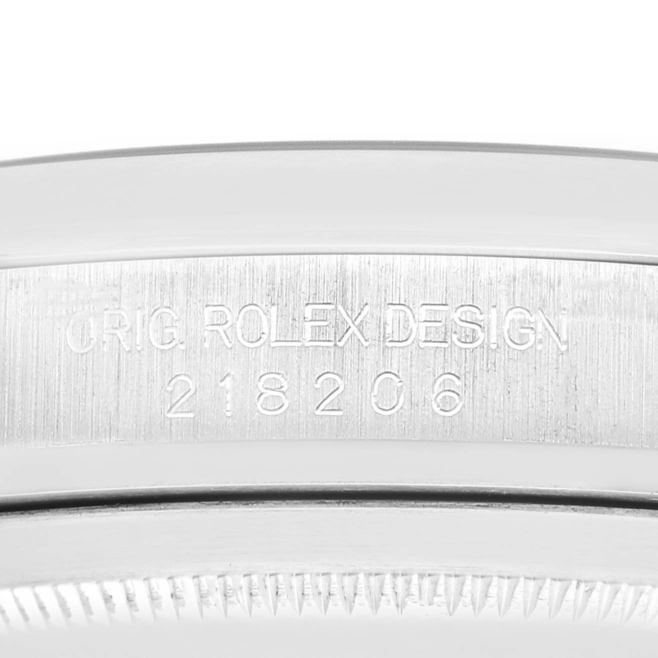 The image shows a close-up of the side engraving on the bezel of a Rolex President 218206 Men's Platinum Blue Dial model.