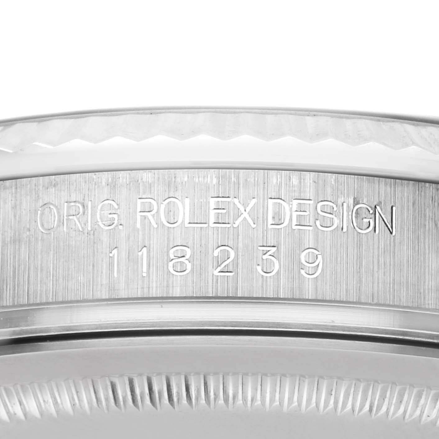 The image shows a detailed view of the side of a Rolex President 118239 Men's White Gold Silver Dial 118239 Men's White Gold Silver Dial watch, highlighting the engraved serial number.