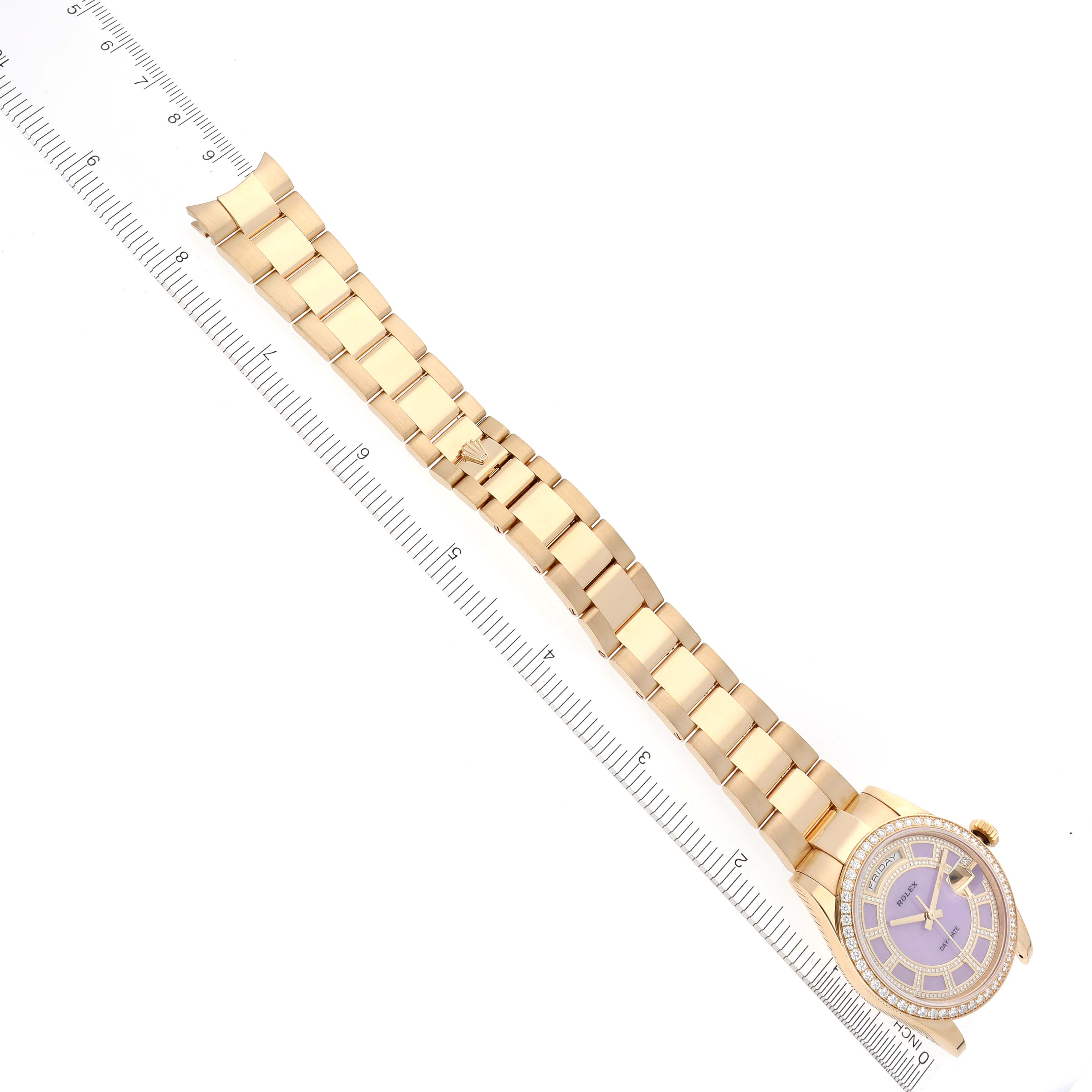 The Rolex President 118348 Men's Yellow Gold Purple Dial 118348 Men's Yellow Gold Purple Dial model watch is shown from a top-down angle, highlighting the bracelet and dial.