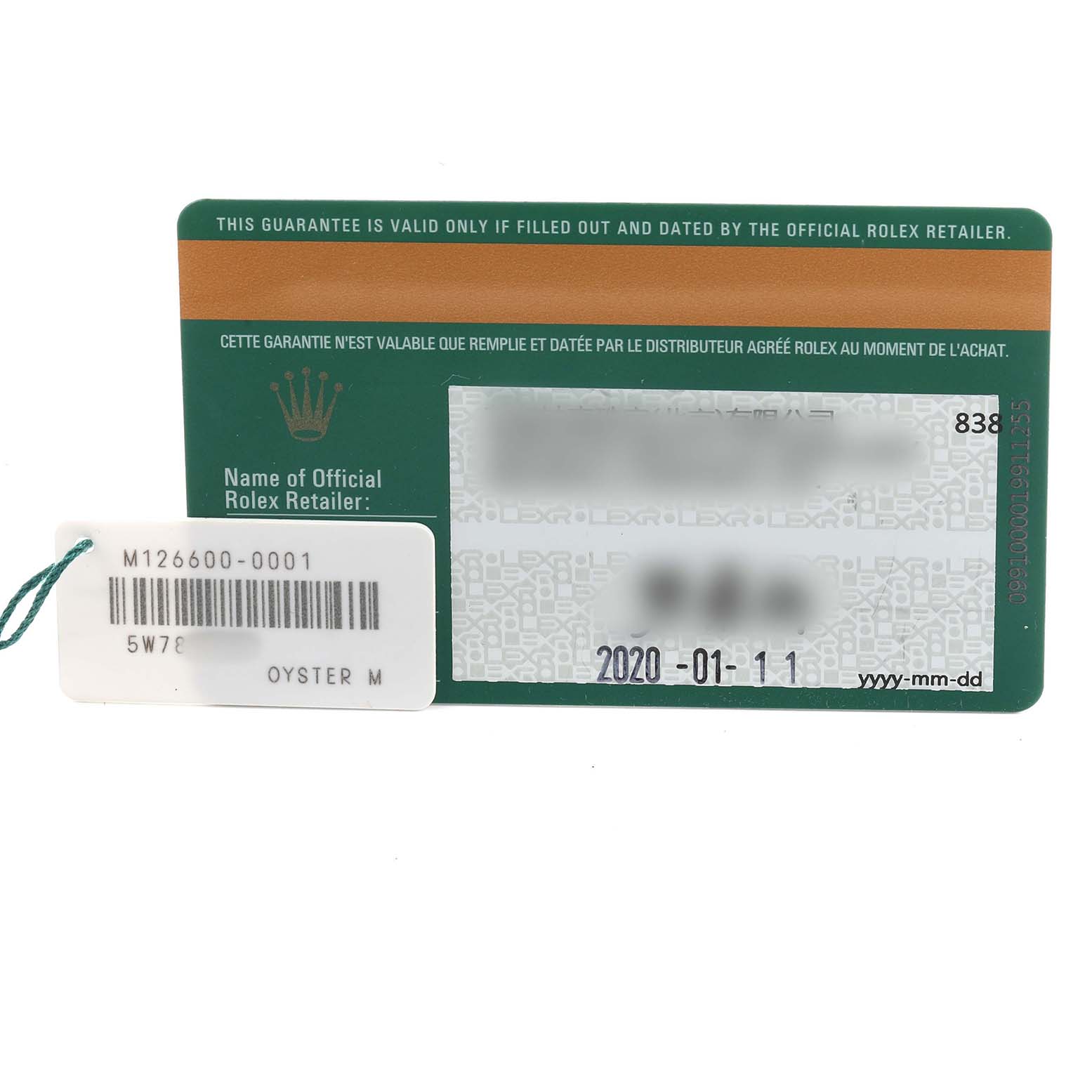 The image shows the warranty card for a Rolex Sea-Dweller 126600 Men's Stainless Steel Black Dial, along with a tag displaying the model number M126600-0001.