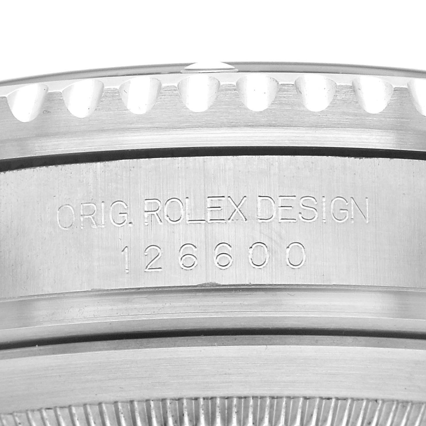 The image shows a close-up of the Rolex Sea-Dweller 126600 Men's Stainless Steel Black Dial model's case side, featuring the engraved design number "126600."