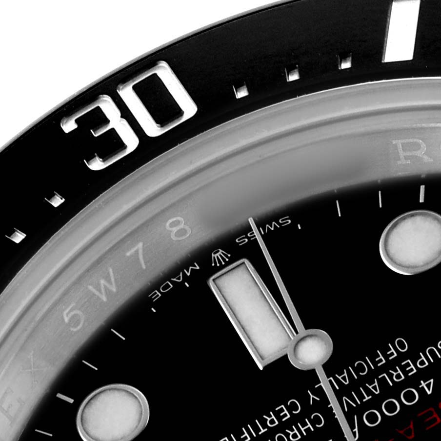 The image shows a close-up of the dial and bezel of a Rolex Sea-Dweller 126600 Men's Stainless Steel Black Dial, highlighting the 30-minute marker.