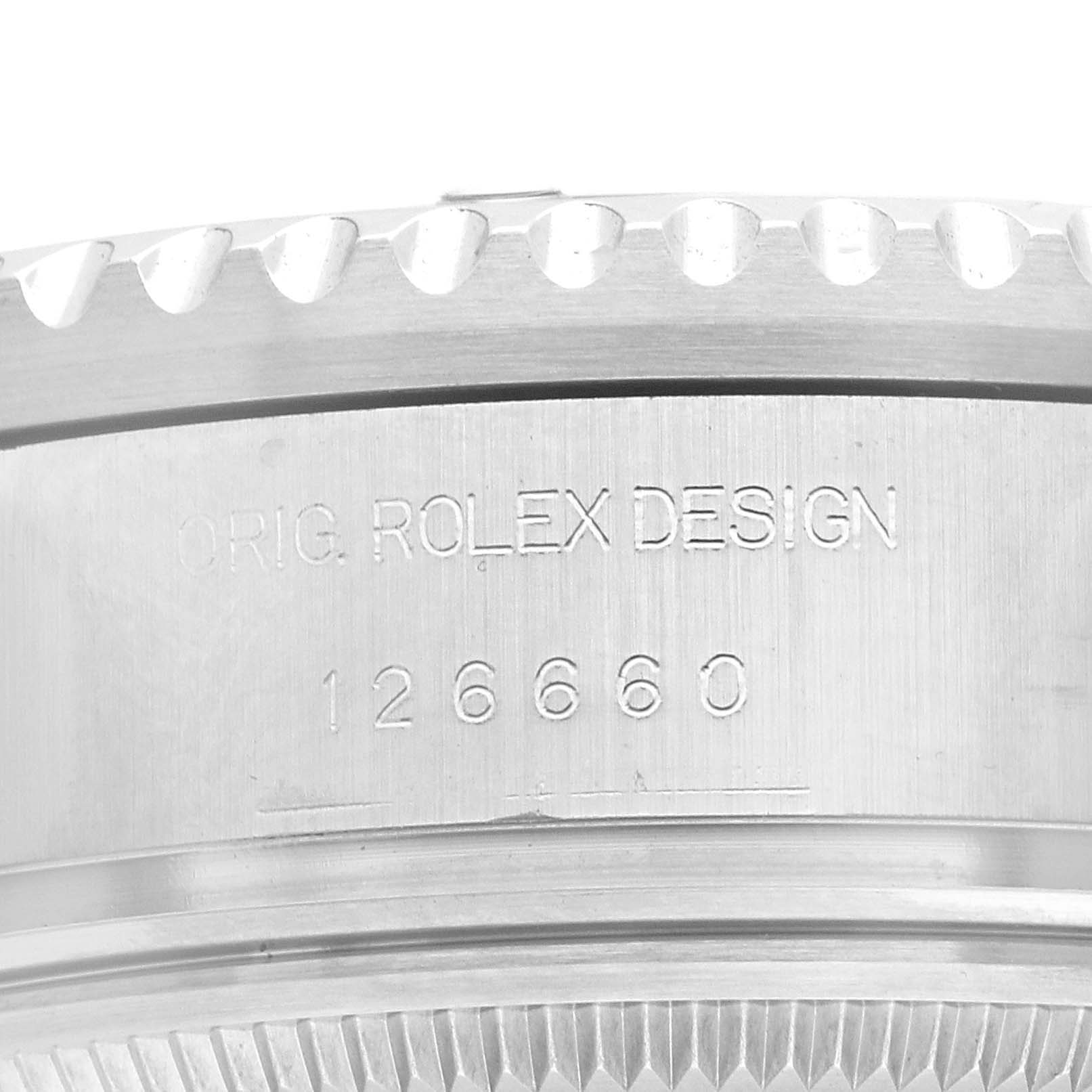 The image shows a close-up of the engraved side of a Rolex Sea-Dweller 126660 Men's Stainless Steel Blue Dial with the model number 126660.