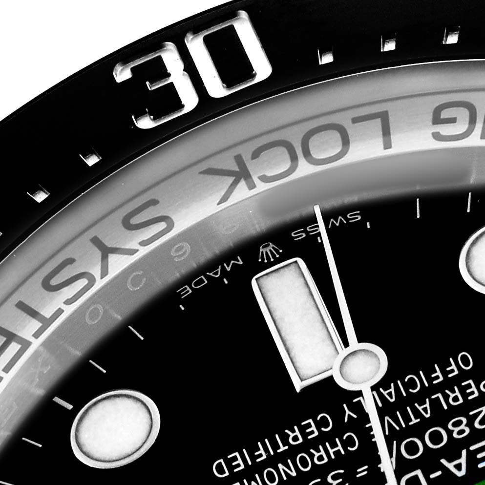 The image shows a close-up of the Rolex Sea-Dweller 126660 Men's Stainless Steel Blue Dial watch, focusing on the bezel and part of the dial.