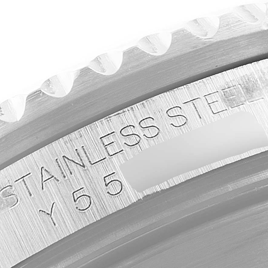 This close-up image shows the stainless steel engraving on the bezel edge of a Rolex Submariner 16610 Men's Stainless Steel Black Dial 16610 Men's Stainless Steel Black Dial watch.