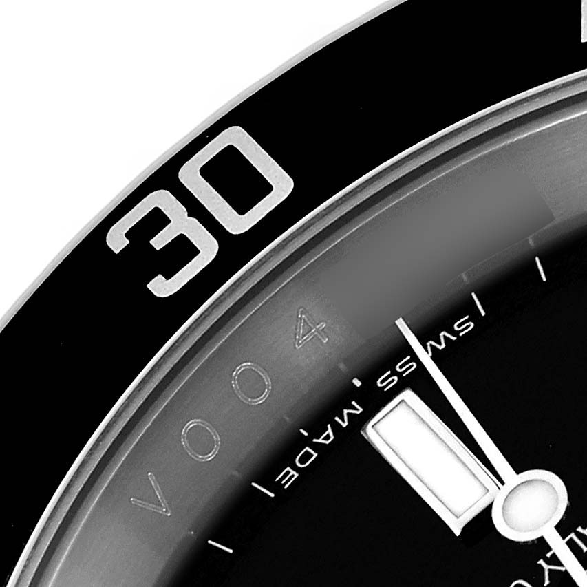 The image shows a close-up of the bezel, dial, and minute hand of a Rolex Submariner 16610 Men
s Stainless Steel Black Dial 16610 Men
s Stainless Steel Black Dial watch at an angle highlighting the "30" marker.