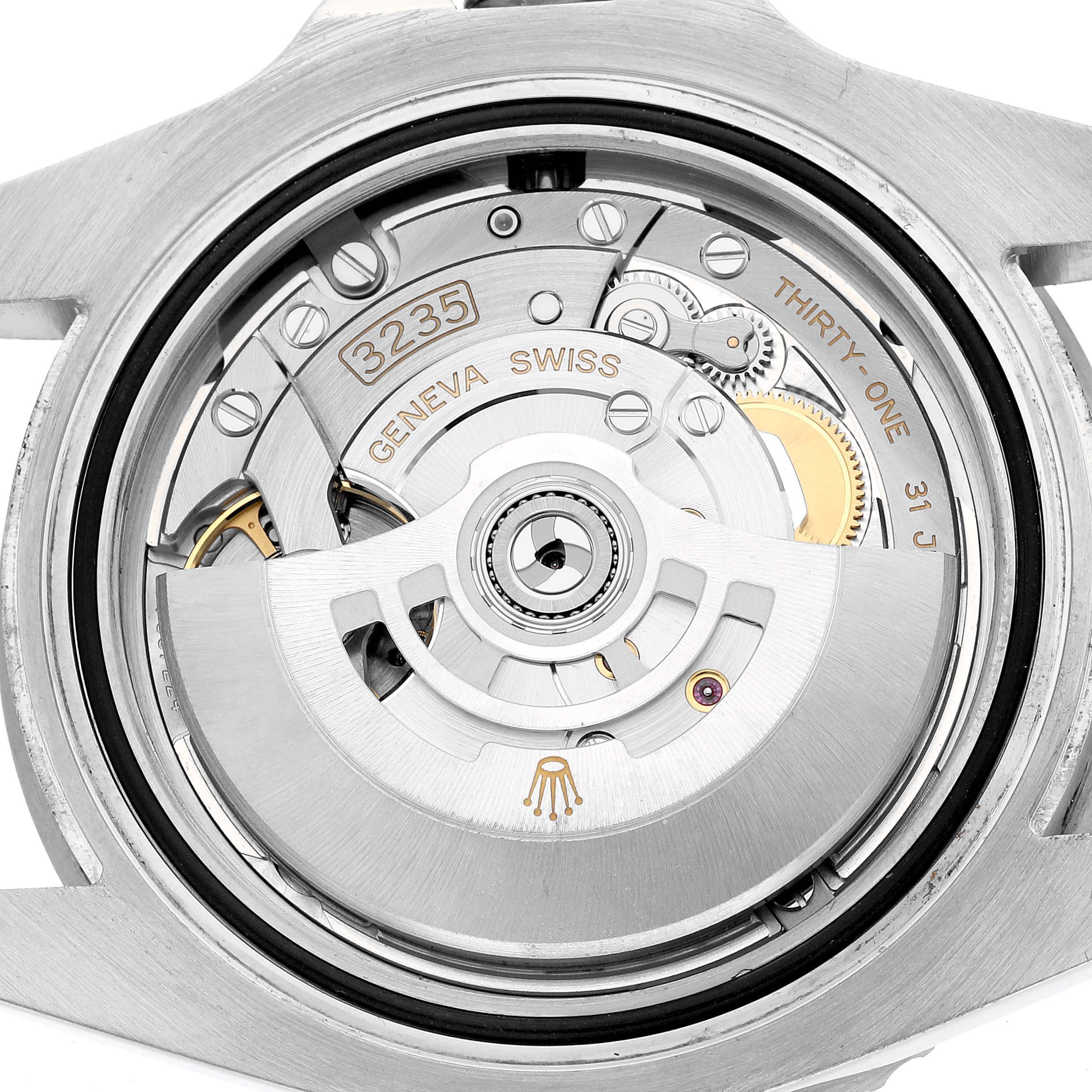 This image shows the open case back view of the Rolex Submariner 126610LN Men's Stainless Steel Black Dial, highlighting the 3235 movement with rotor and gears.