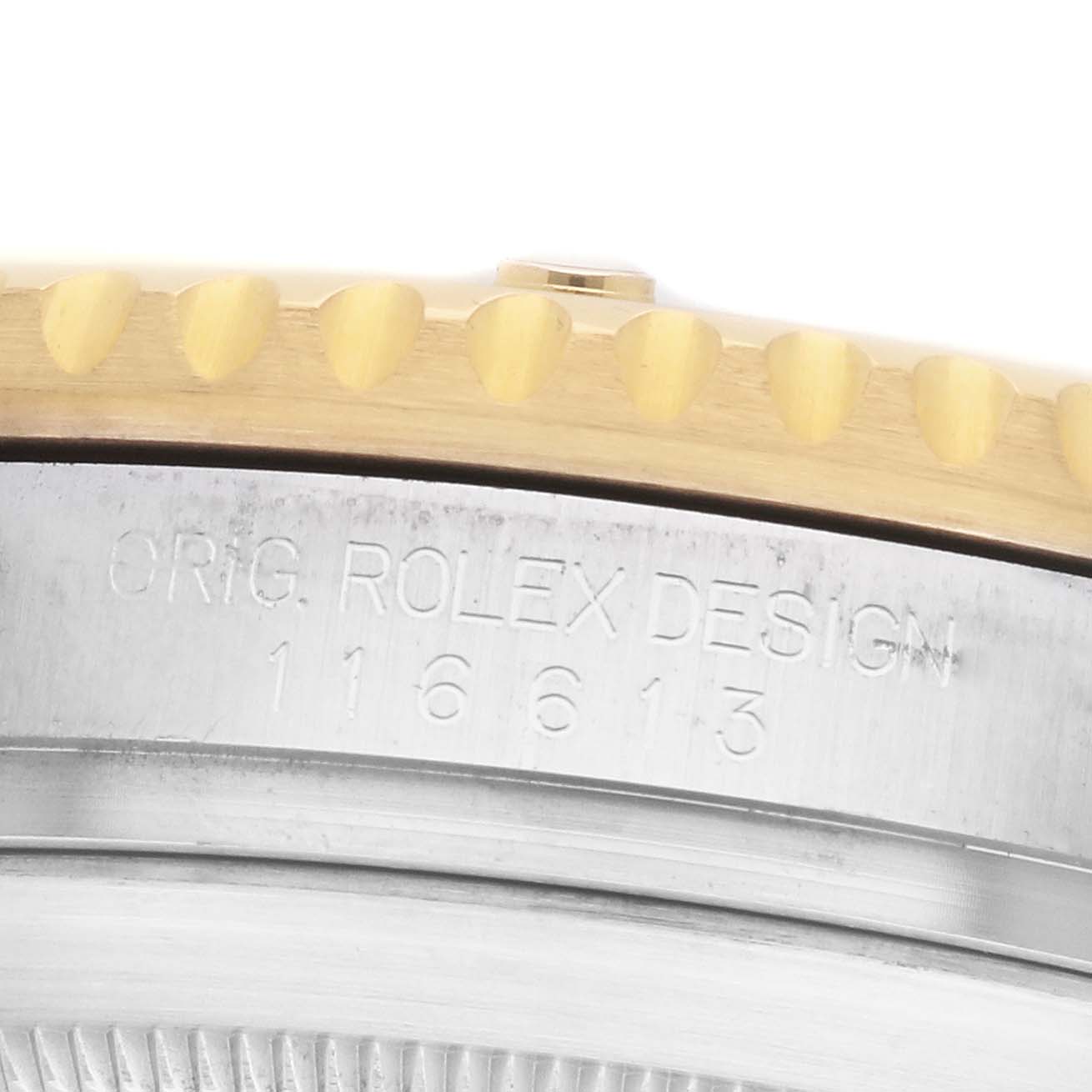 The image shows a close-up of the side of a Rolex Submariner 116613 Men's Steel and Gold (two tone) Blue Dial, highlighting the engraved case and part of the bezel edge.
