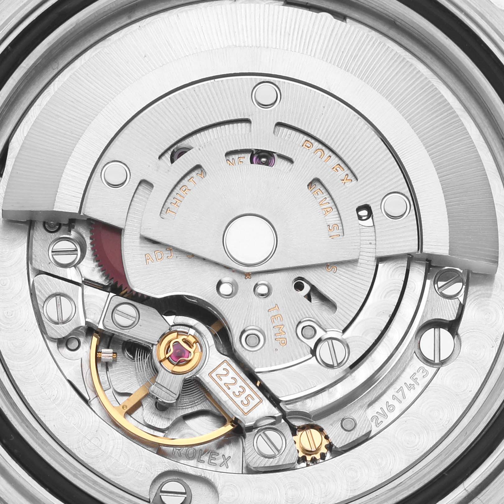 The image shows a close-up of the Rolex Yacht-Master 168622 Men's Stainless Steel Silver Dial 168622 Men's Stainless Steel Silver Dial watch movement, highlighting gears and intricate mechanical parts.