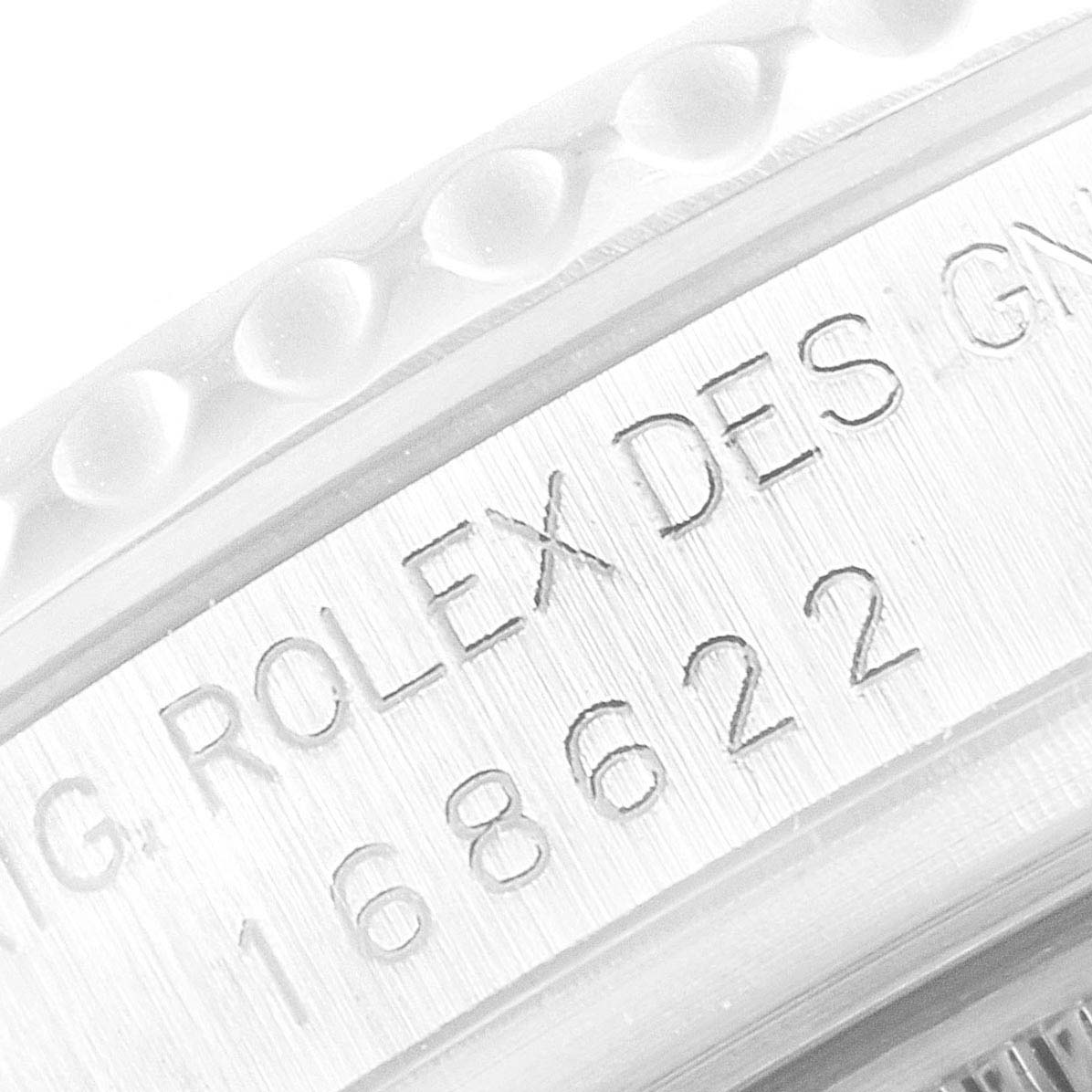 This image shows an angled close-up of the side of a Rolex Yacht-Master 168622 Men
s Stainless Steel Silver Dial 168622 Men
s Stainless Steel Silver Dial watch model number 168622, displaying its engraved details.