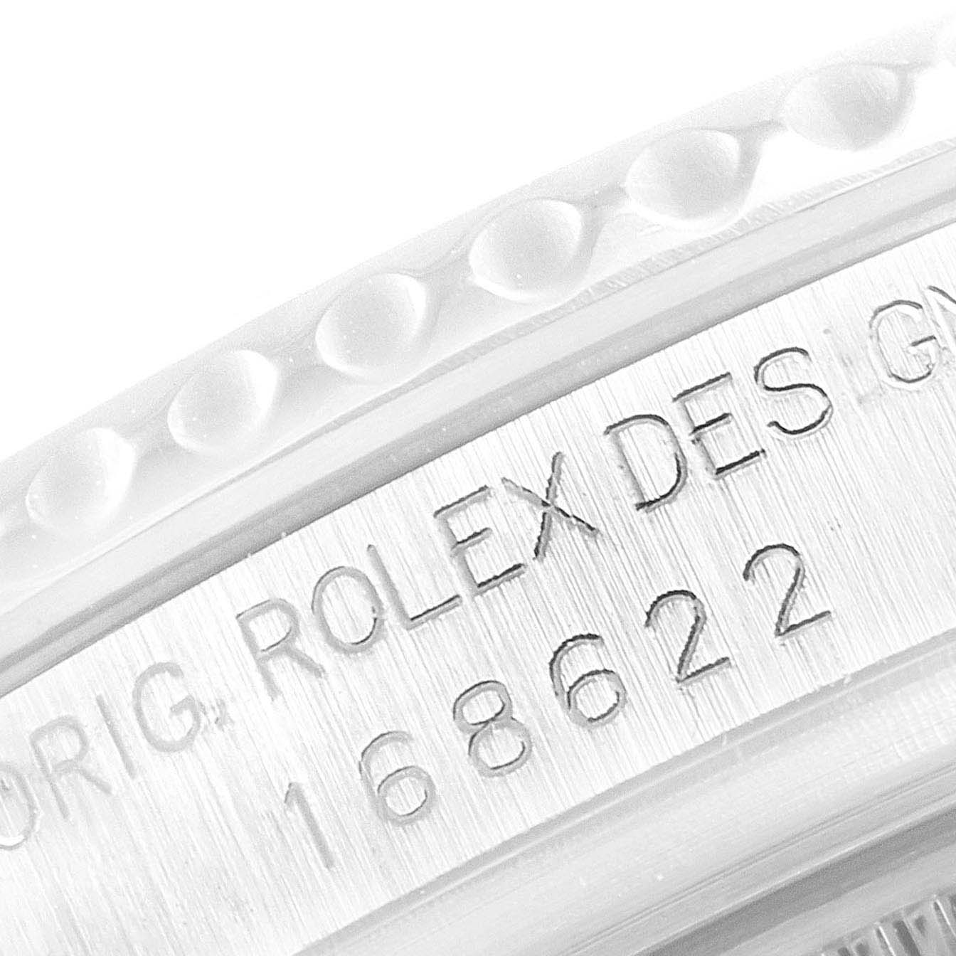 The image shows a close-up angle of the serial number and part of the bezel of the Yacht-Master model by Rolex.