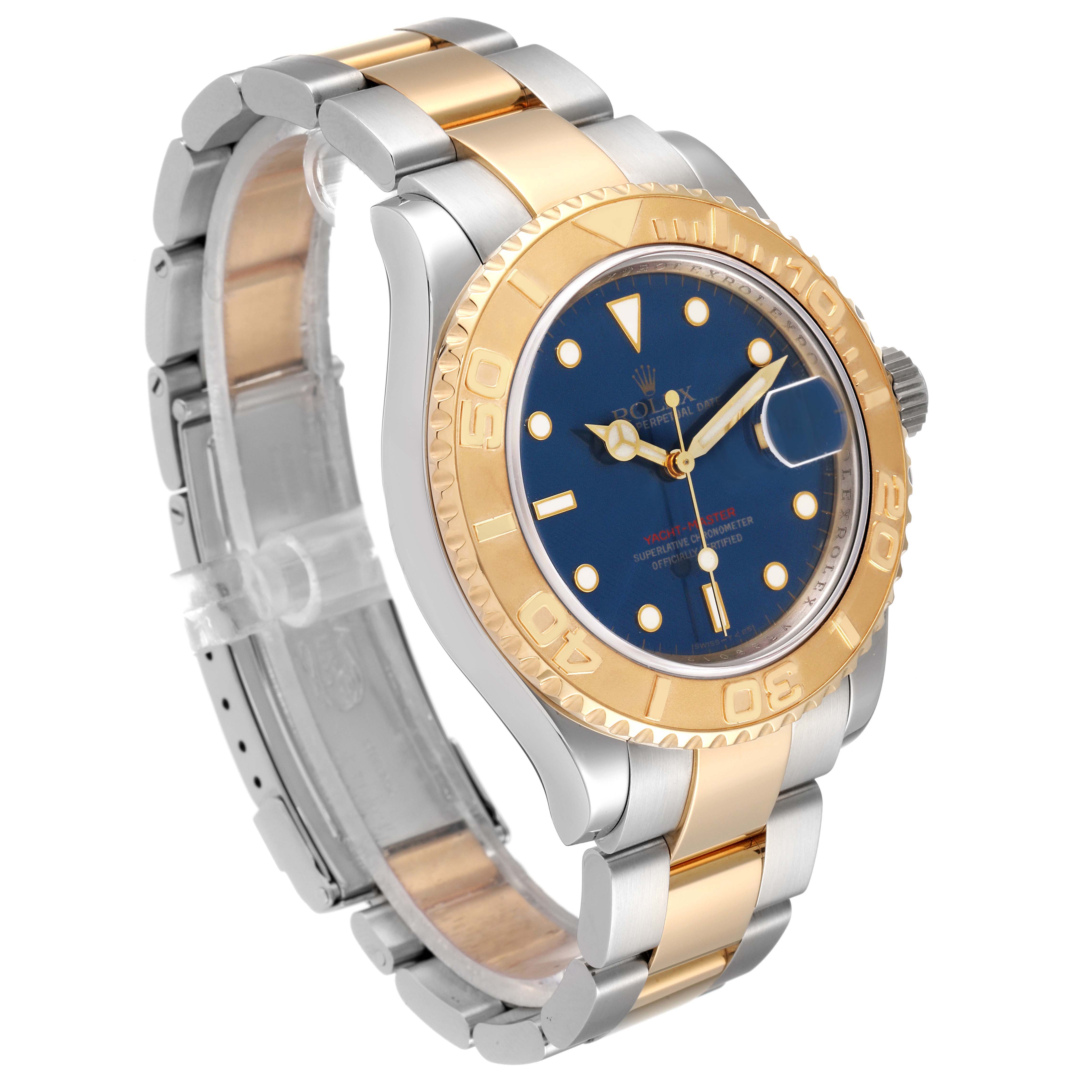 The image shows a Rolex Yacht-Master 16623 Men's Steel and Gold (two tone) Blue Dial 16623 Men's Steel and Gold (two tone) Blue Dial watch at a slight angle, highlighting its gold bezel, blue dial, and two-tone bracelet.