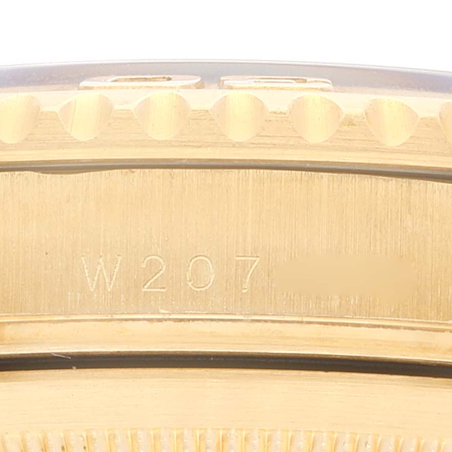 This close-up image shows the side of the bezel and case, with engraved markings of the Rolex Yacht-Master 16628 Men's Yellow Gold Champagne Dial 16628 Men's Yellow Gold Champagne Dial watch.