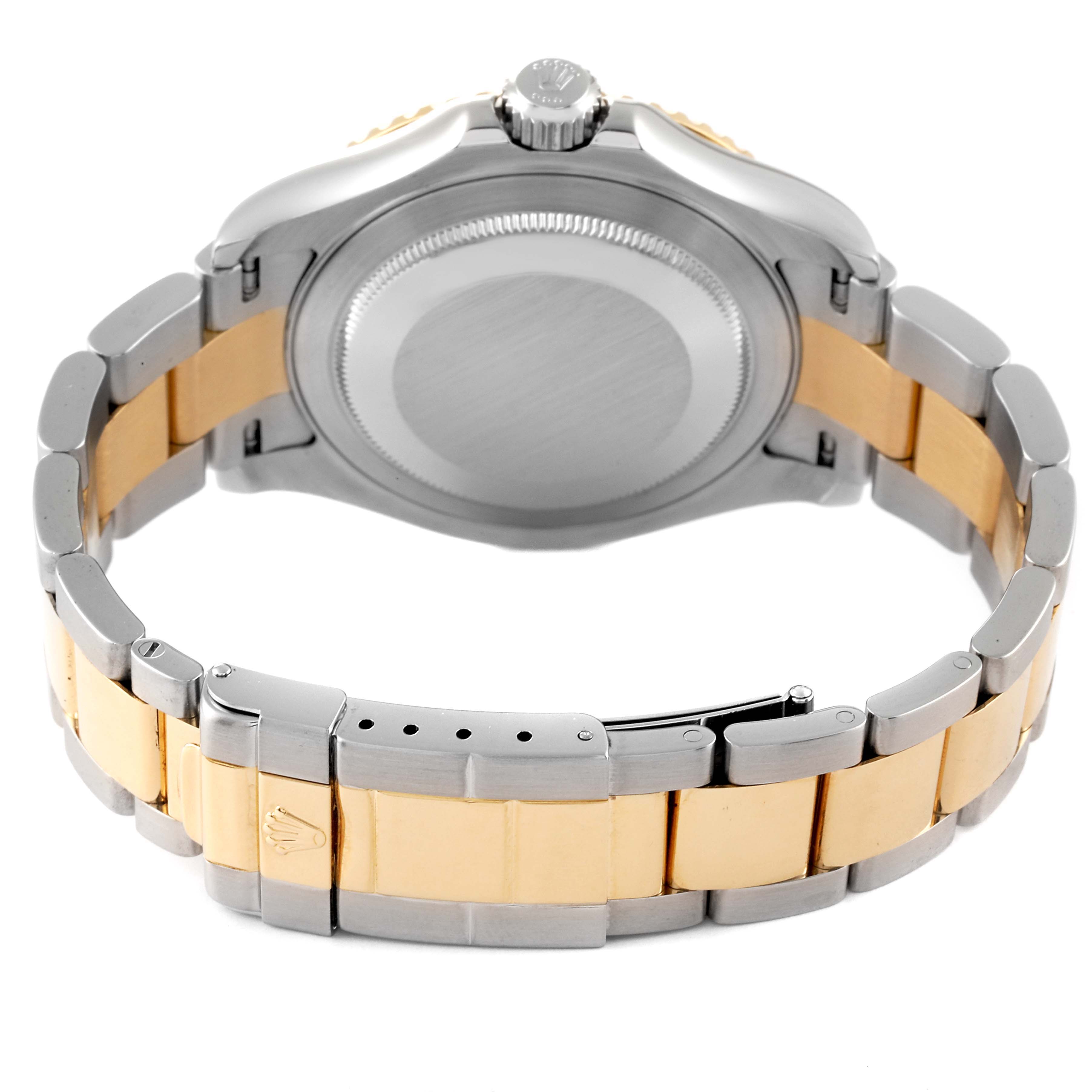 The Rolex Yacht-Master 16623 Men's Steel and Gold (two tone) Blue Dial 16623 Men's Steel and Gold (two tone) Blue Dial watch is shown from the back, highlighting the case, crown, and two-tone bracelet.