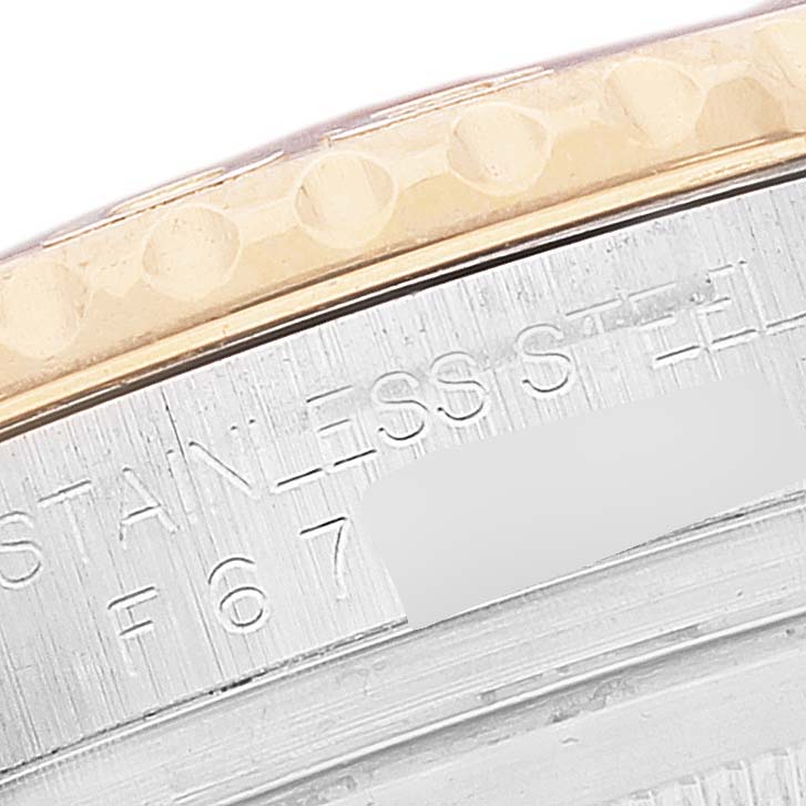 This image shows a close-up of the stainless steel and gold bezel of a Rolex Yacht-Master 16623 Men's Steel and Gold (two tone) Blue Dial 16623 Men's Steel and Gold (two tone) Blue Dial watch.