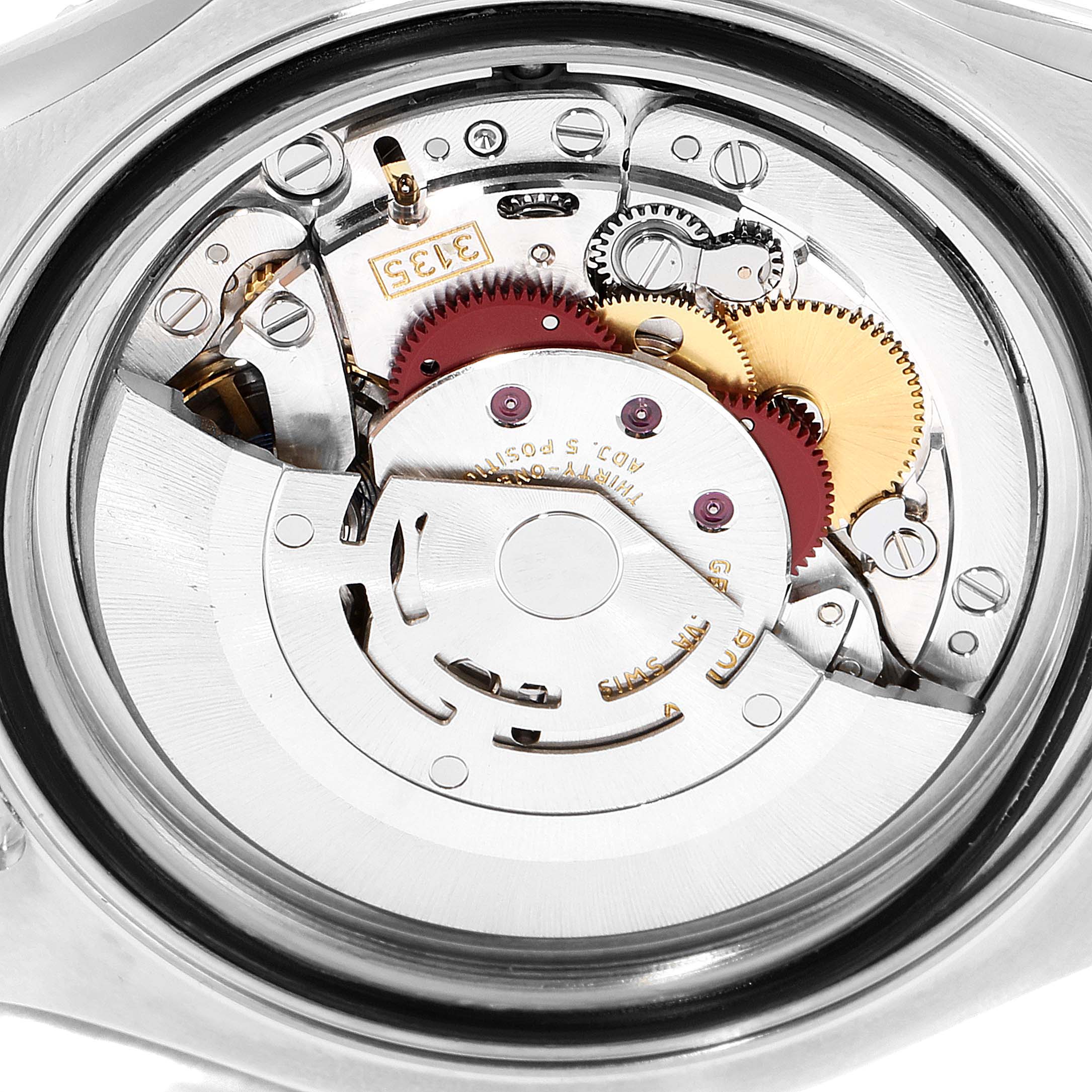 This image shows a close-up view of the Rolex Yacht-Master 16623 Men's Steel and Gold (two tone) Mother of Pearl Dial 16623 Men's Steel and Gold (two tone) Mother of Pearl Dial watch's internal movement components.