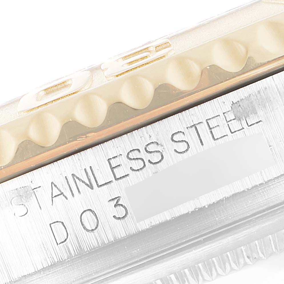 The image shows a close-up of the Yacht-Master Rolex's bezel and part of the casing with "STAINLESS STEEL" engraved.