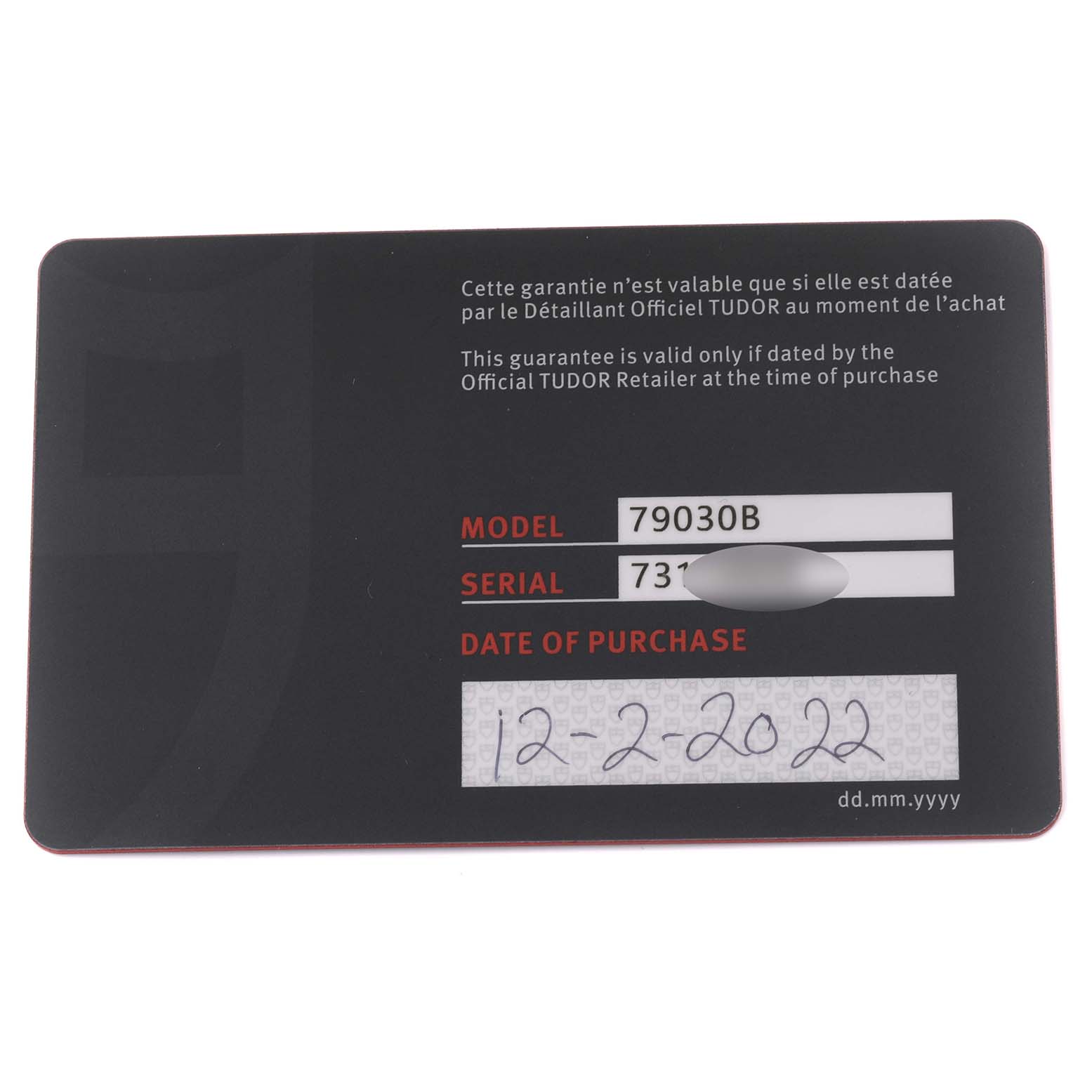 The image shows a warranty card for the Tudor Heritage Black Bay 79030B Men
s Stainless Steel Blue Dial 79030B Men
s Stainless Steel Blue Dial watch, displaying the model number and date of purchase.